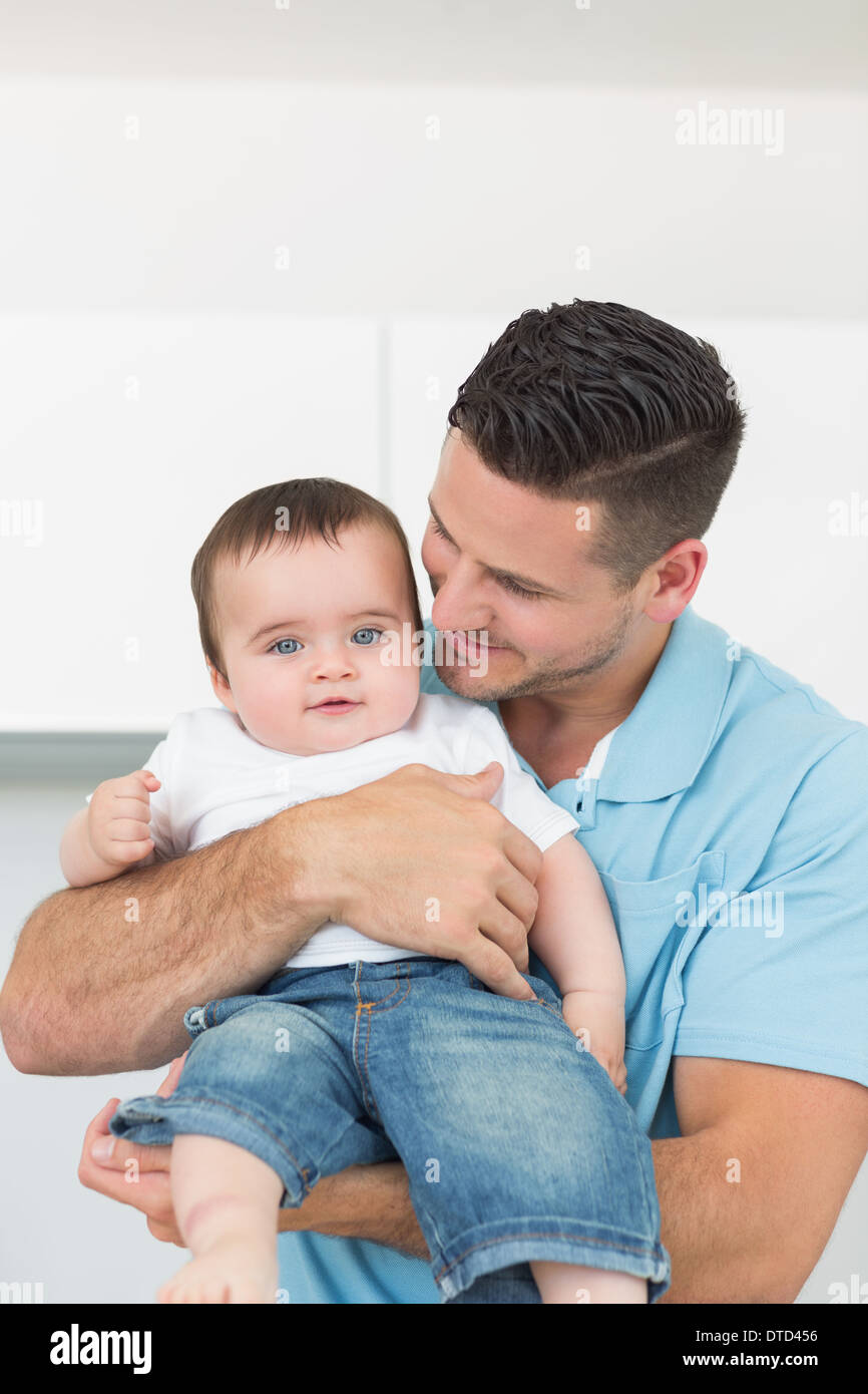 Loving father carrying baby Stock Photo