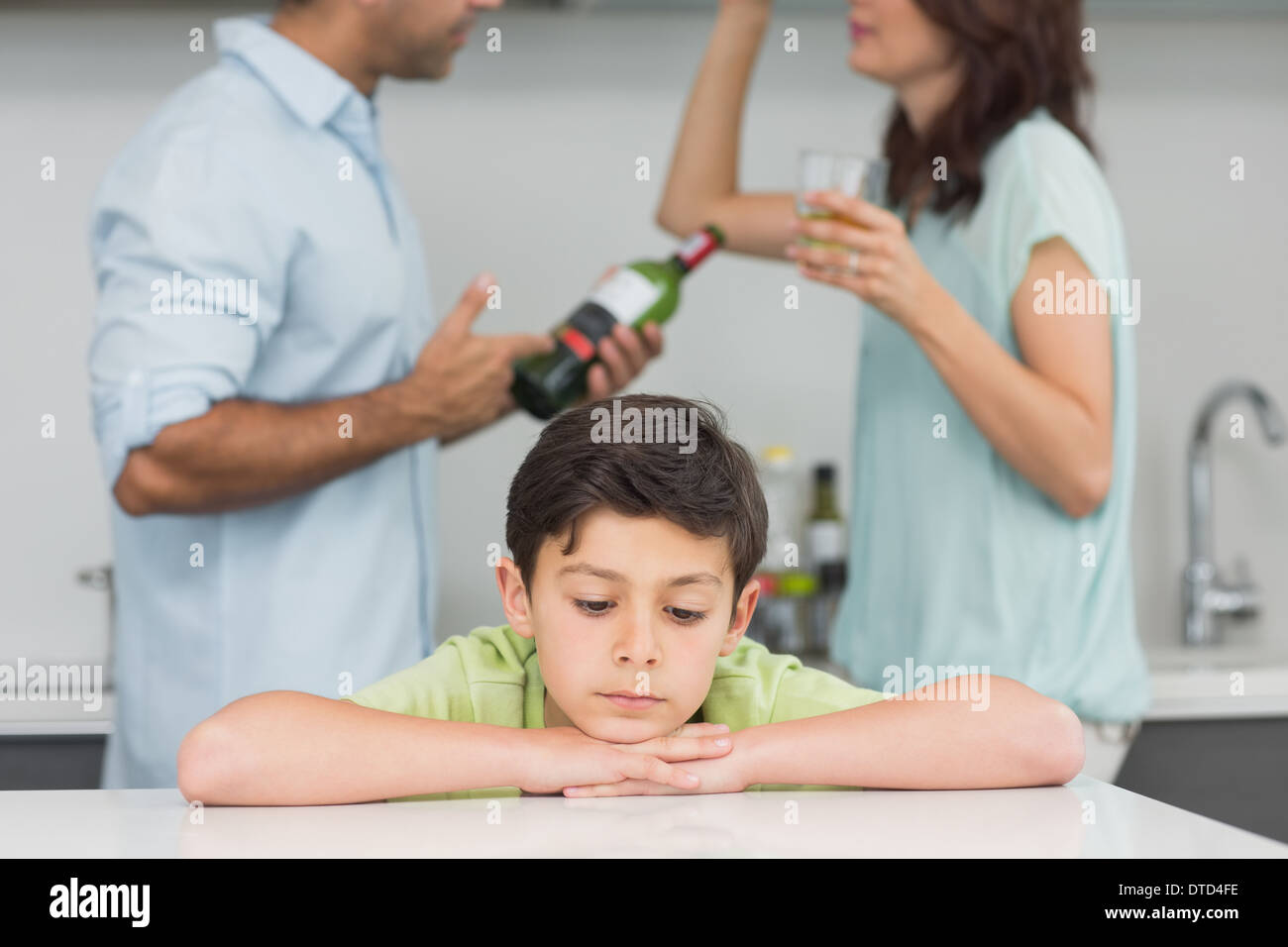 Closeup of a sad son while parents quarreling Stock Photo