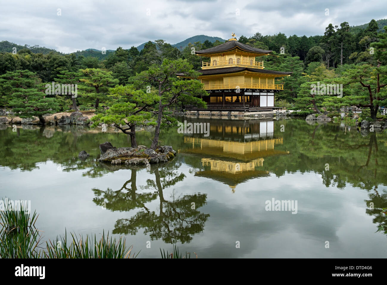 Kinkakuji Temple (Golden Pavilion Temple) and landscaped trees reflecting in Kyōko-chi (Mirror Pond) Stock Photo