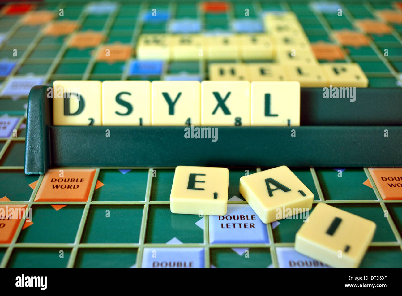 Scrabble board and tiles, mis-spelling the word dyslexia Stock Photo
