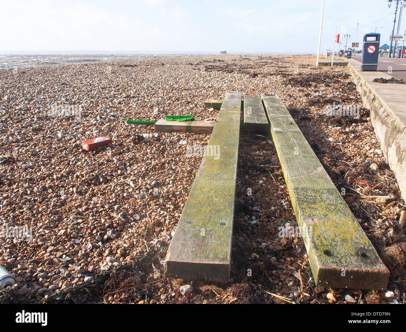 Portsmouth, Hampshire, England 15th February 2014Wood from the Damaged south Parade Pier lies along the beach after high winds and strong tides battered the pier overnight causing further structural damage. the pier has been closed to the public due to structural safety issues for over a year Credit:  simon evans/Alamy Live News Stock Photo