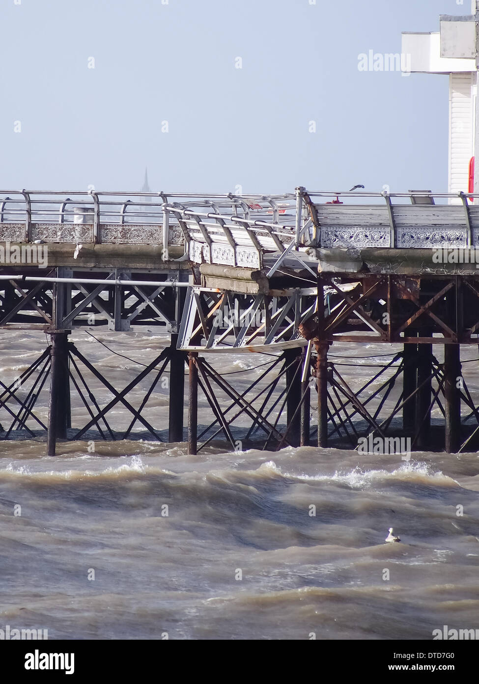 Portsmouth, Hampshire, England 15th February 2014.  South Parade Pier has been damaged by strong winds and large waves, leaving pieces of the Georgian structure hanging from the side of the pier. The pier has been closed to the public for over a year due to structural safety issues Credit:  simon evans/Alamy Live News Stock Photo
