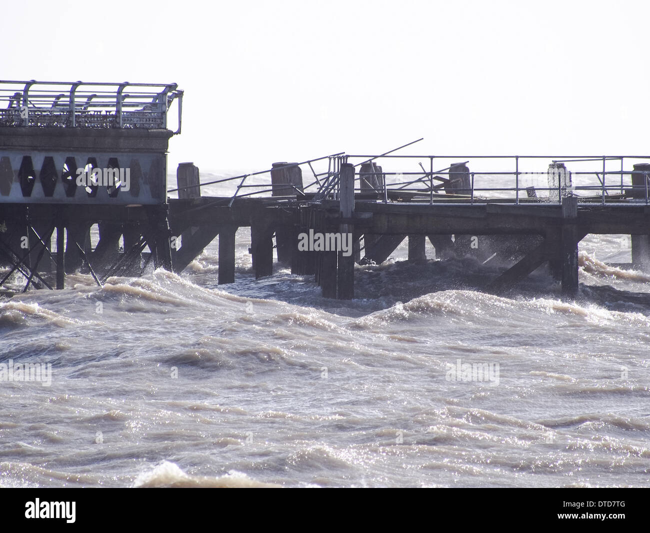 Portsmouth, Hampshire, England 15th february 2014. South Parade pier stands damaged in the solent due to high winds and large waves. pieces of the Georgian structure lie along Southsea beach. The pier has been closed to the public due to structural safety issues for over a year Credit:  simon evans/Alamy Live News Stock Photo