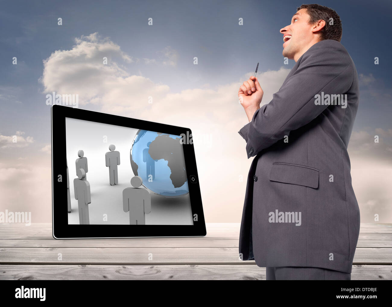 Composite image of thoughtful businessman holding pen Stock Photo - Alamy