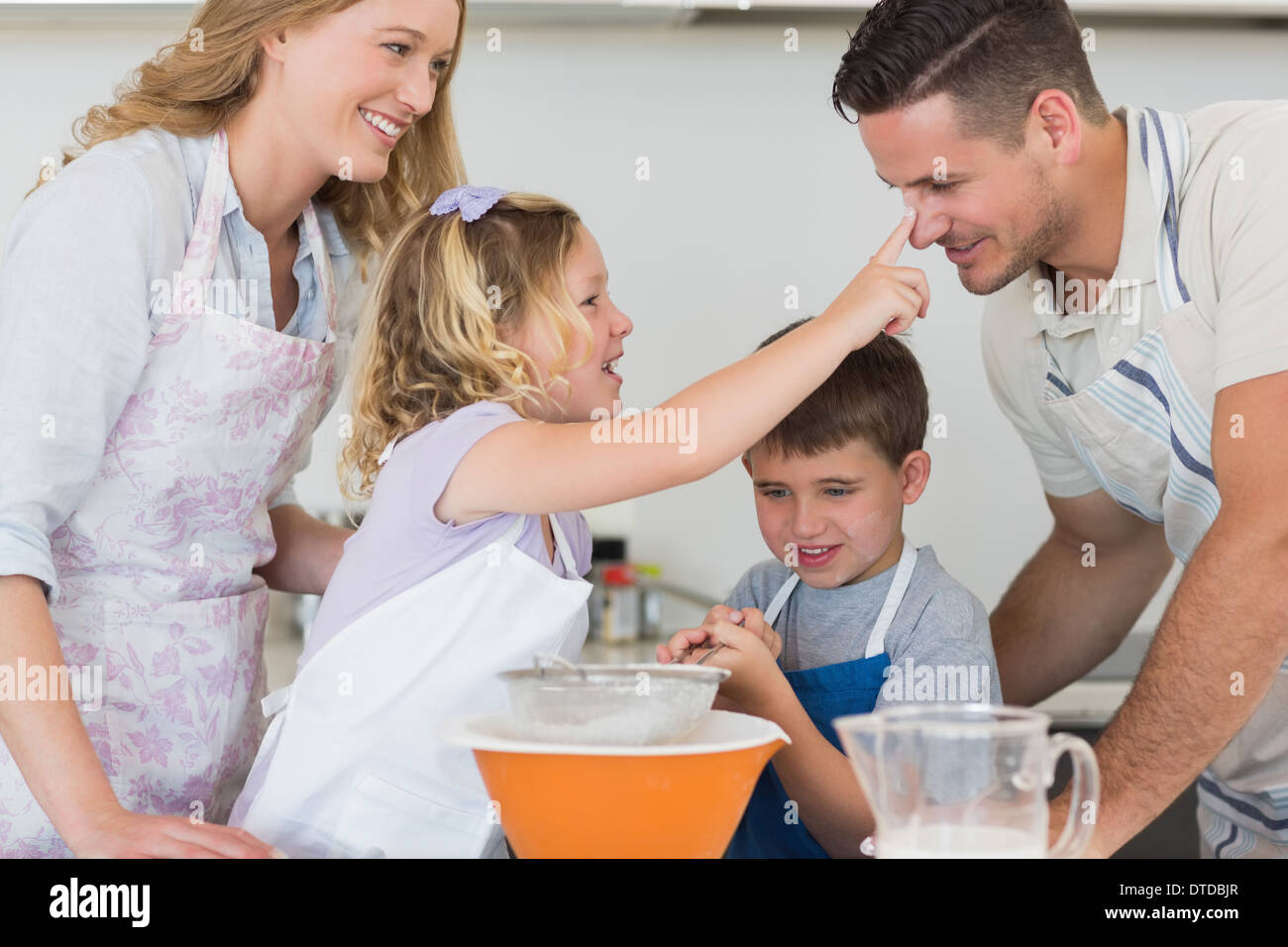 Happy parents looking playful children hi-res stock photography and ...