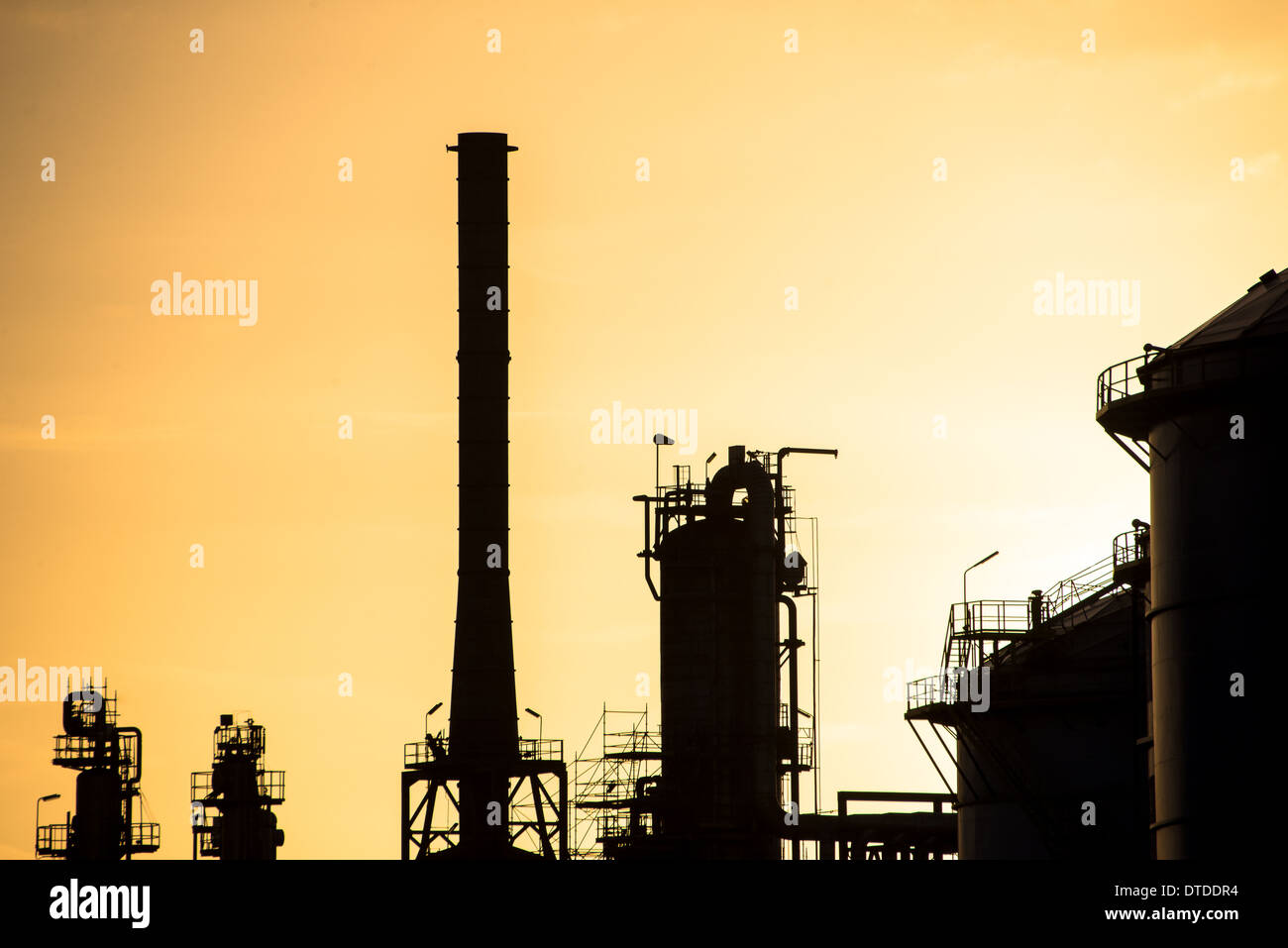 oil refinery at sunset in Rotterdam harbour Stock Photo