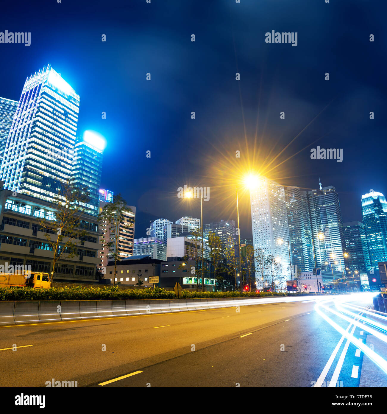 Highway and city at night Stock Photo - Alamy