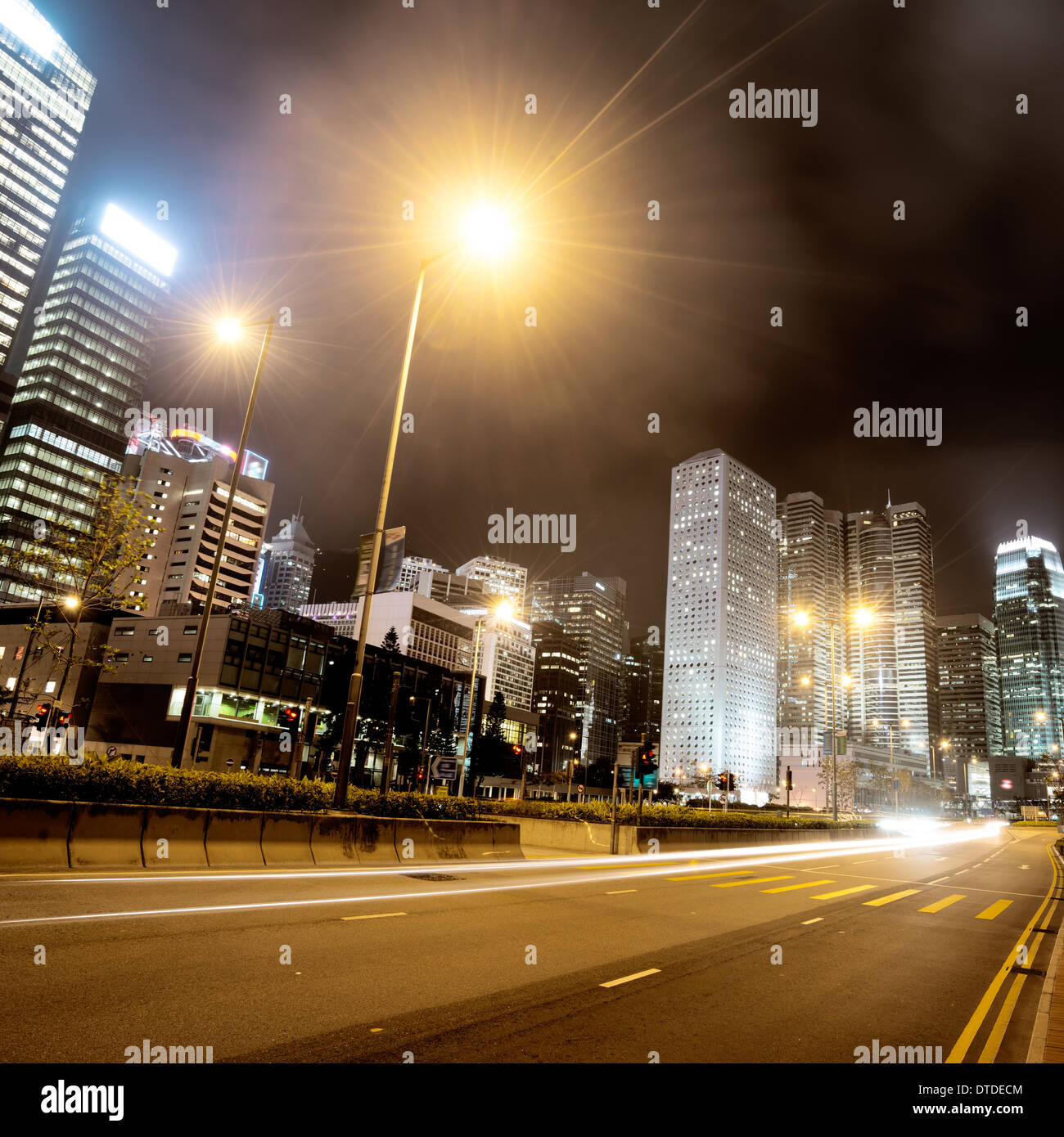 Highway and city at night Stock Photo - Alamy