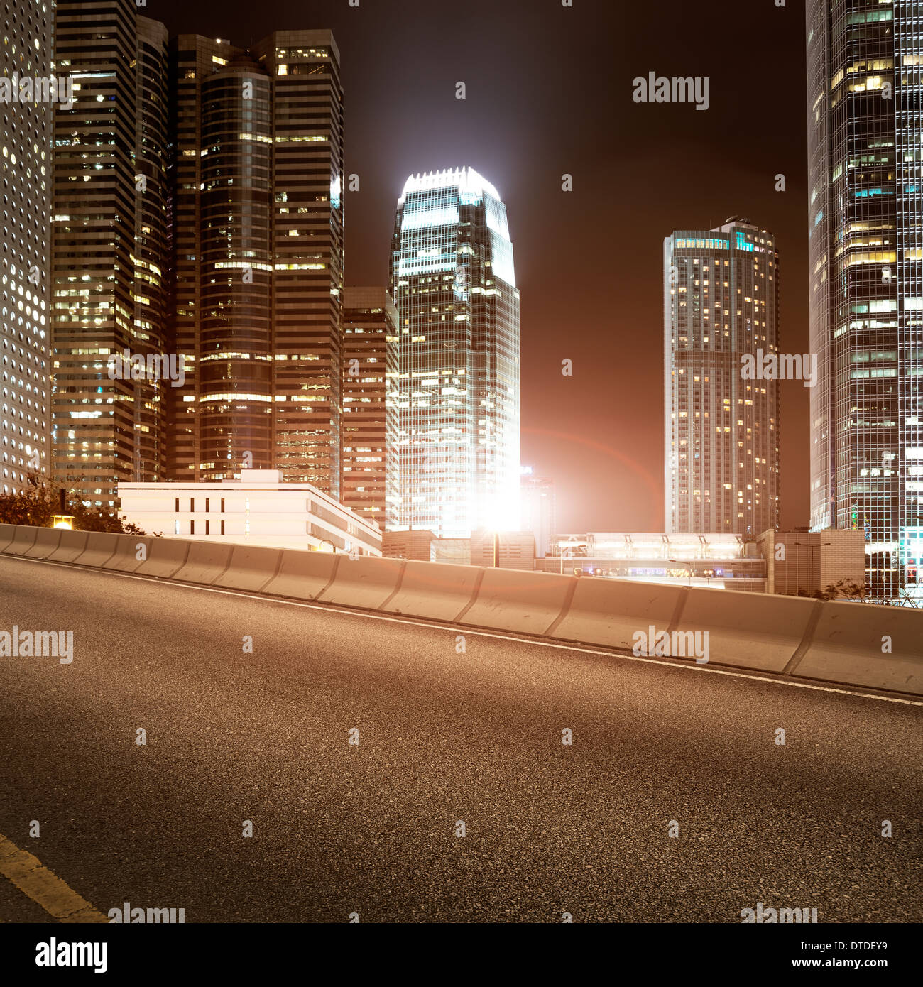 Highway and city at night Stock Photo - Alamy