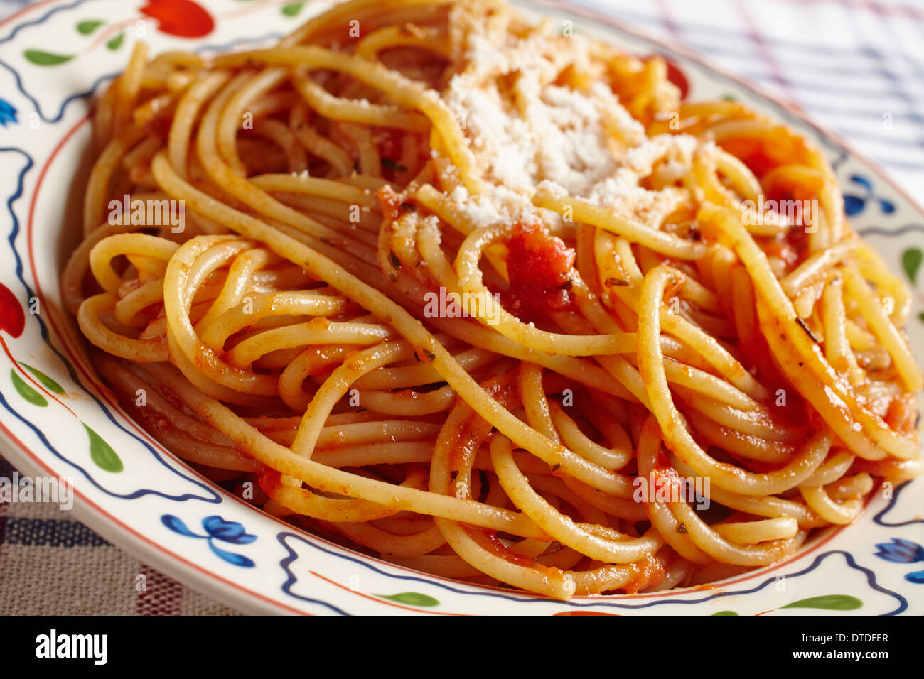 spaghetti with tomato sauce and grated cheese Stock Photo