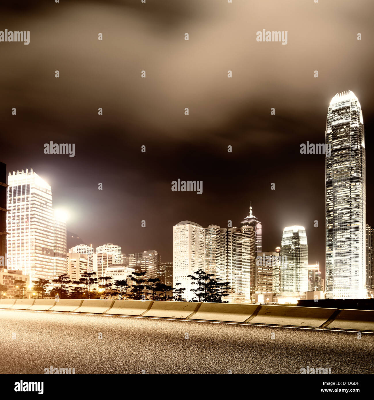 Highway and city at night Stock Photo - Alamy