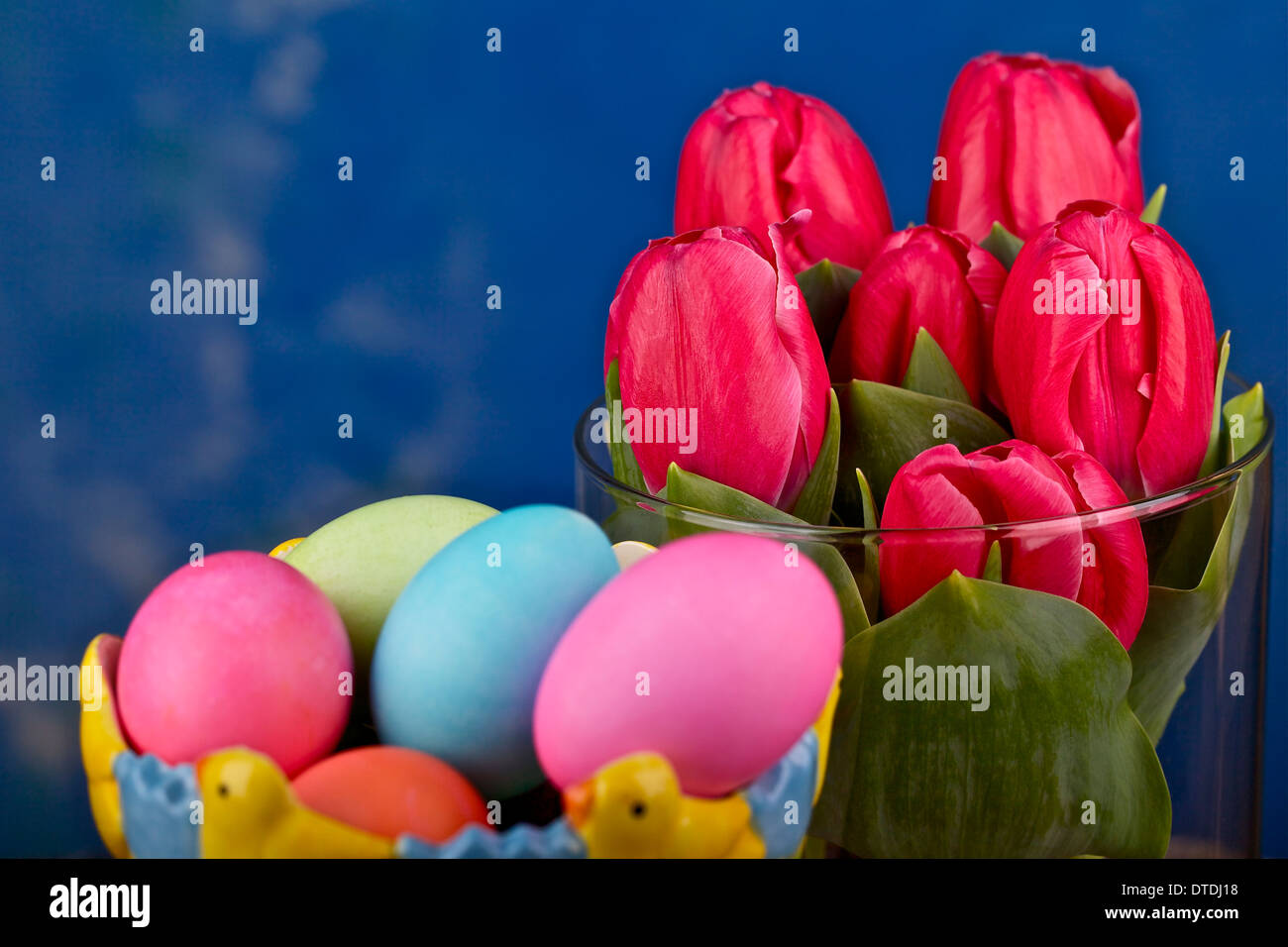 Easter eggs and tulips in a vase Stock Photo