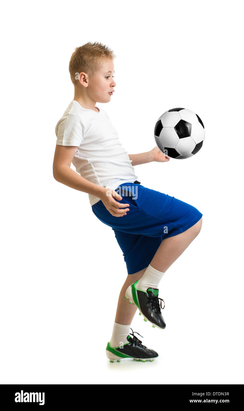 Boy kicking soccer ball by knee isolated on white. Training exercise. Stock Photo