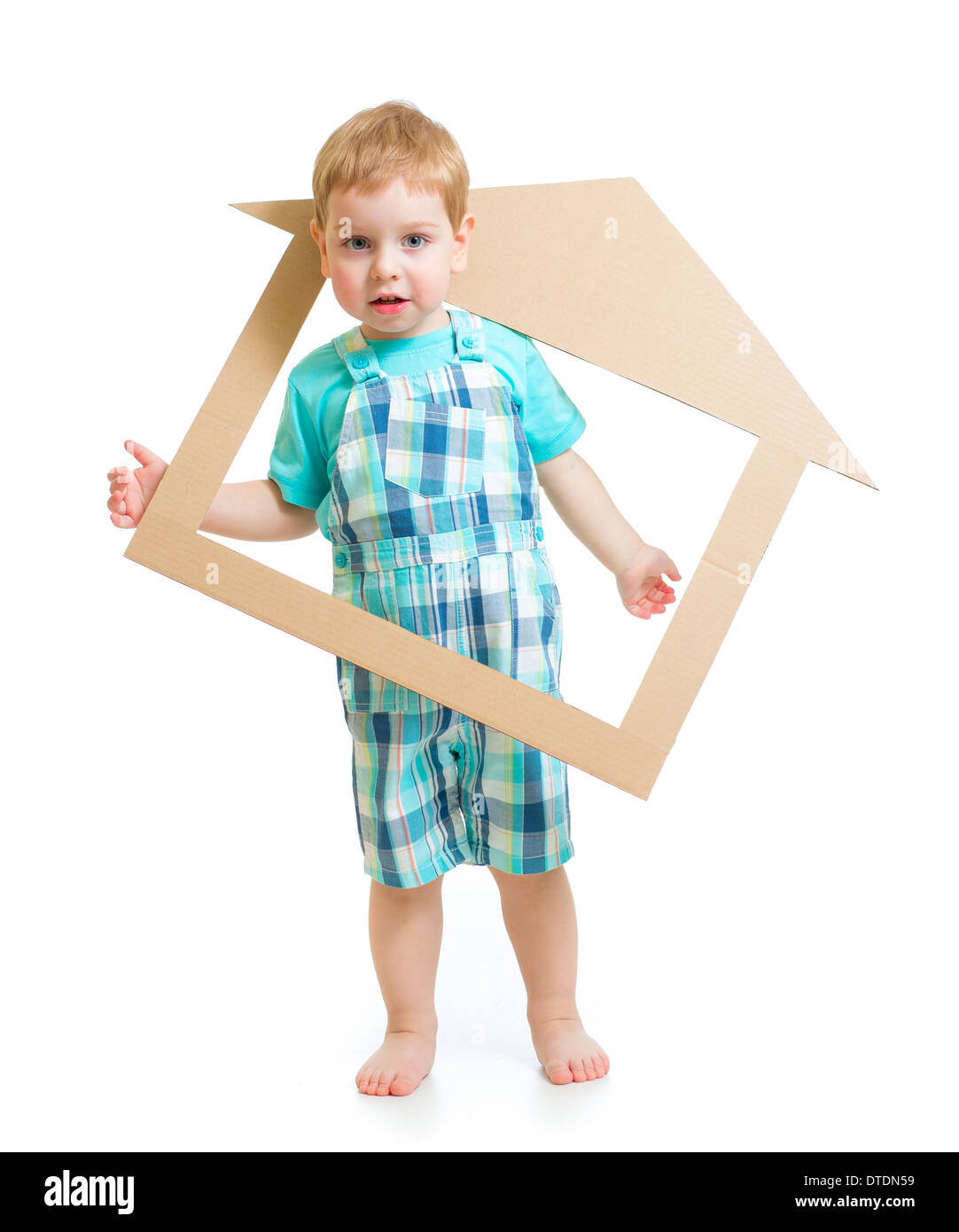 Adorable boy in own cardboard home or room concept Stock Photo