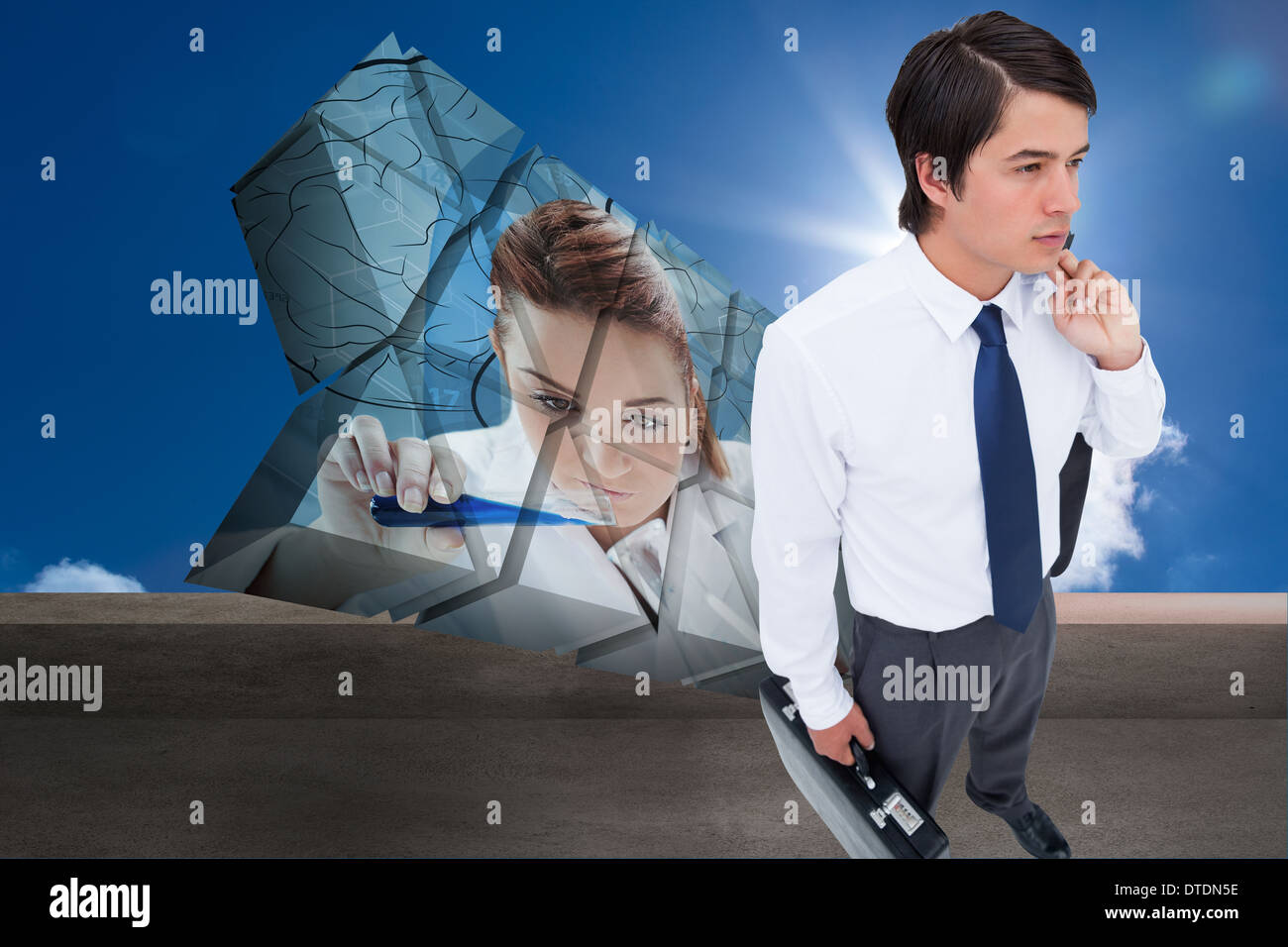 Composite image of young tradesman with his jacket and suitcase Stock Photo