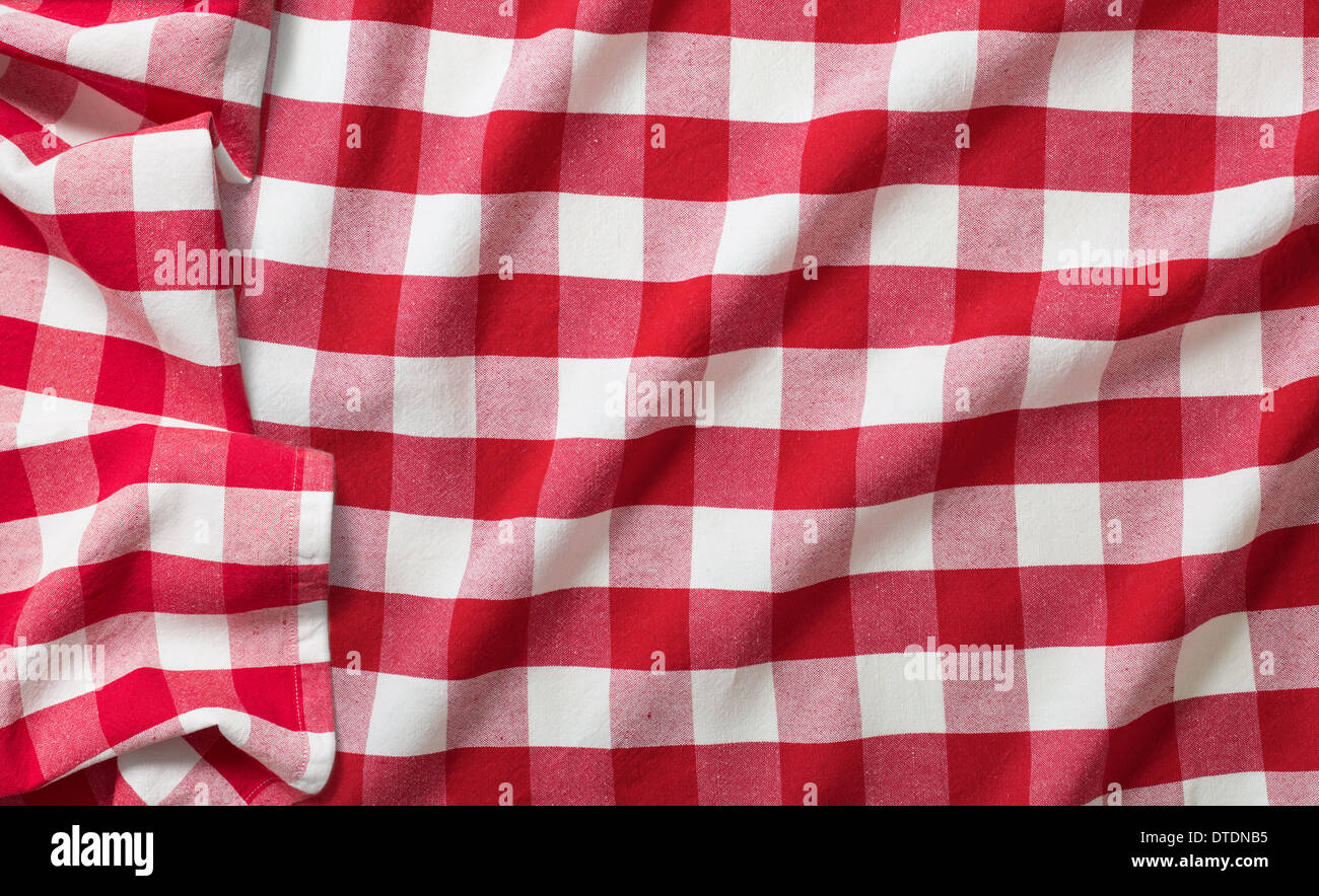 red crumpled checkered picnic tablecloth Stock Photo