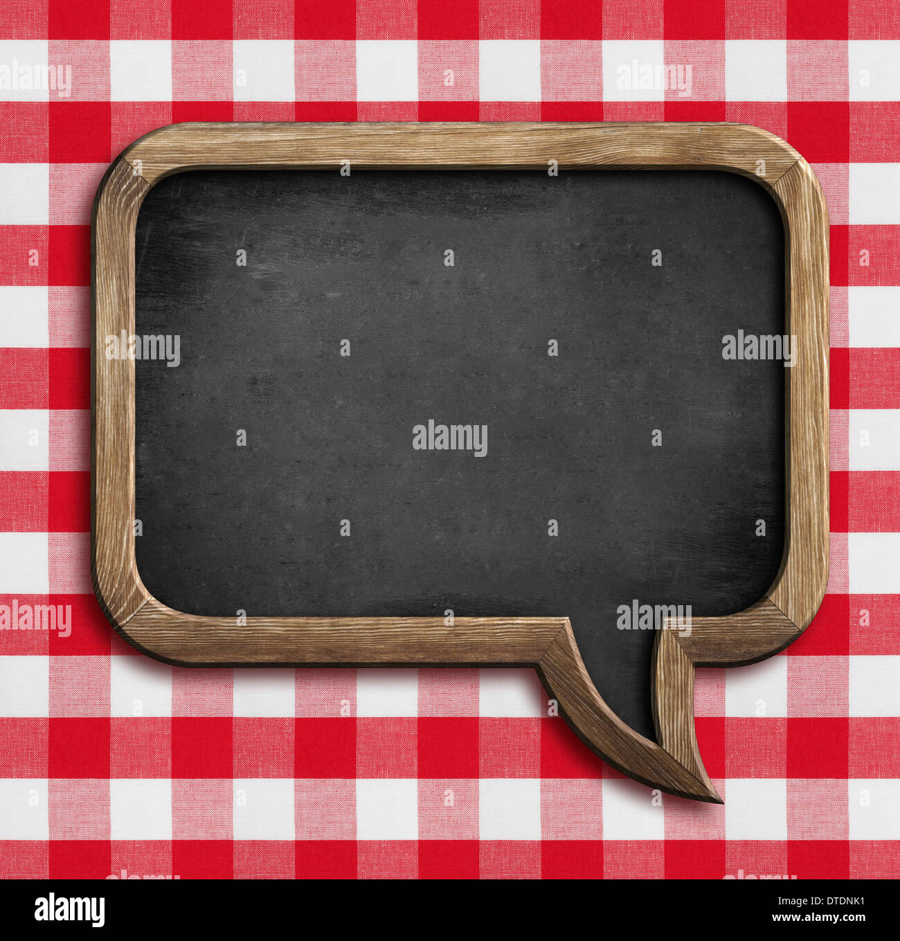 menu chalkboard speech bubble on table with picnic tablecloth Stock Photo