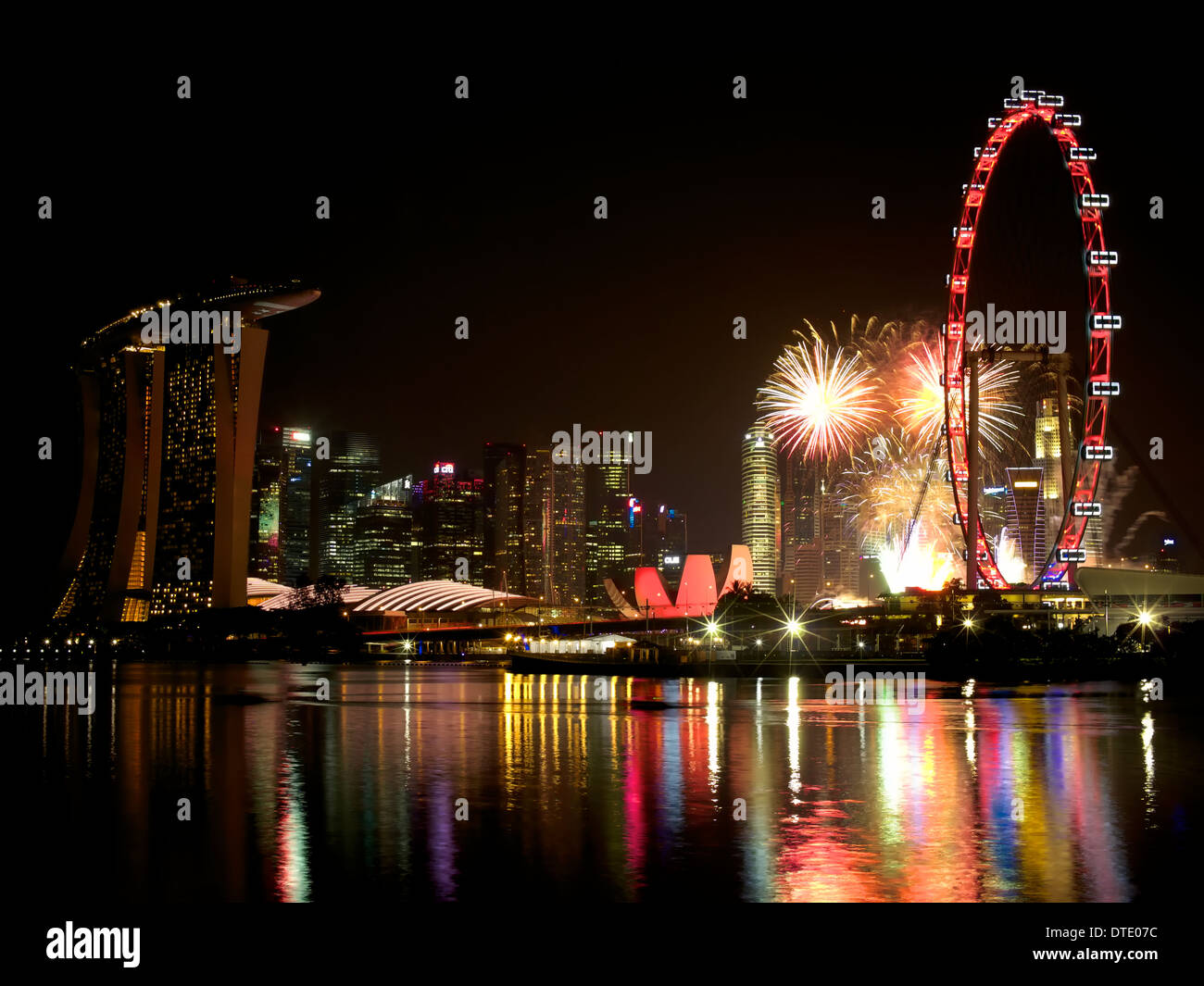 View of Marina Bay area from Bay East Garden during Singapore's National Day Celebration with fireworks display Stock Photo