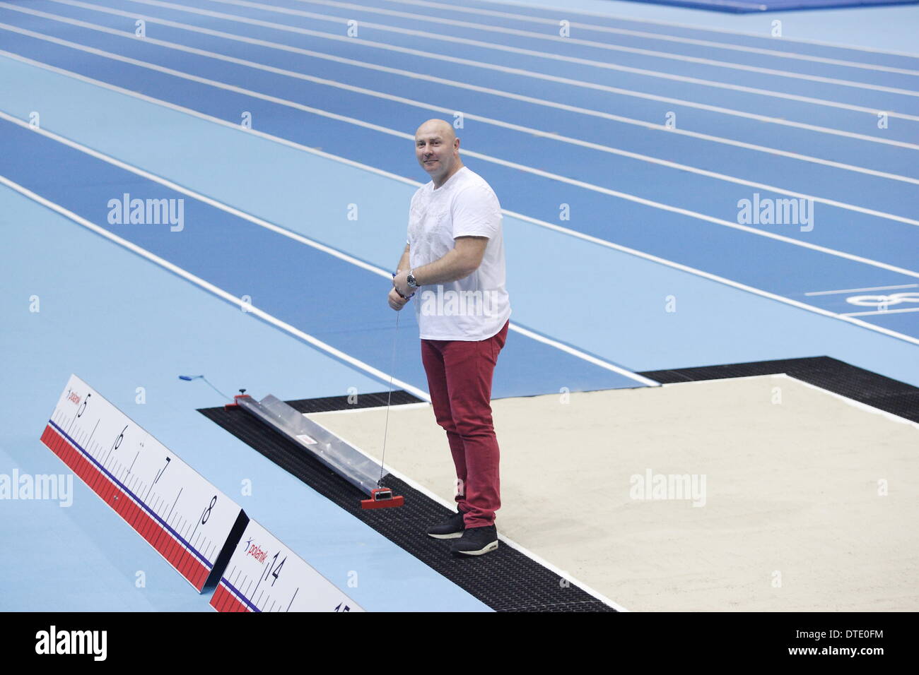 Sopot, Poland 16th, February 2014 First run on the new athletics track build especially for the IAAF World Indoor Championships Sopot 2014 at ERGO Arena sports hall. Local politics and athlets take part in the run. Olympic champion Szymon Ziolkowski takes part in the run. Stock Photo
