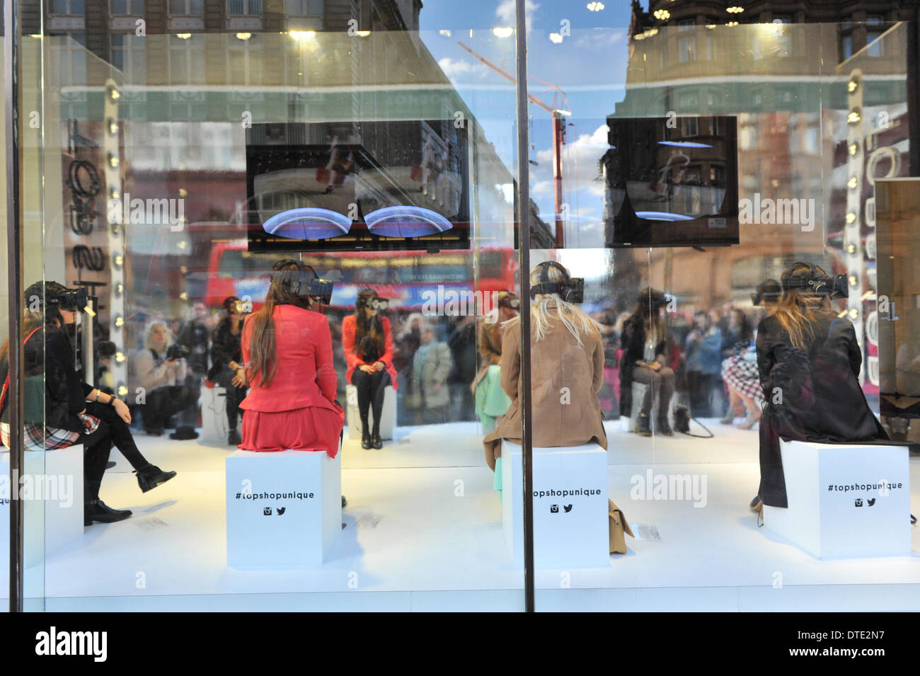 Oxford Street, London, UK. 16th February 2014. Topshop virtual reality  catwalk show. Five lucky winners get to watch a live catwalk show being  staged in Tate Modern, they watch the show using