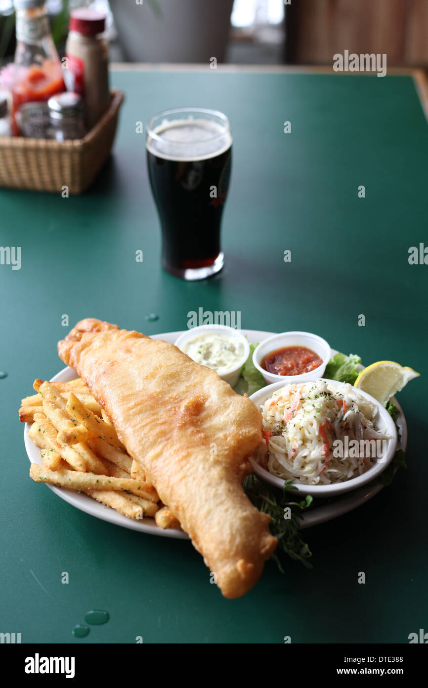 Fish & Chips with a pint of stout beer Stock Photo