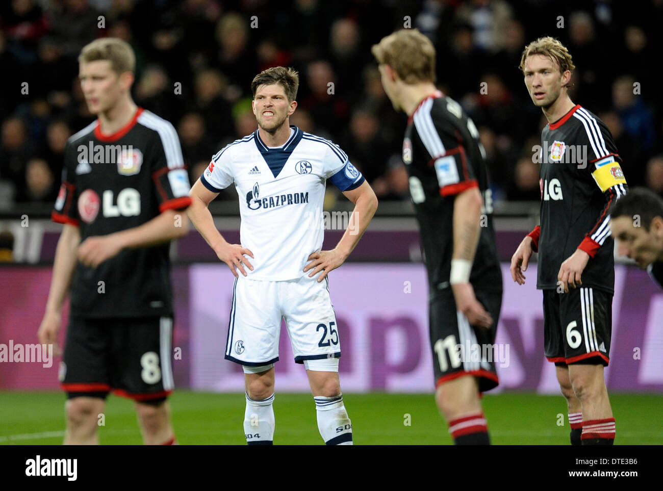 BayArena Leverkusen Germany ,15th February .2014, Football Bundesliga  Season 2013/14, matchday 21, Bayer 04 Leverkusen - Schalke 04 1:2 ---  Klaas-Jan Huntelaar (S04) shows his teeth, Leverkusens Simon Rolfes, Stefan  Kie§ling (Kiessling)