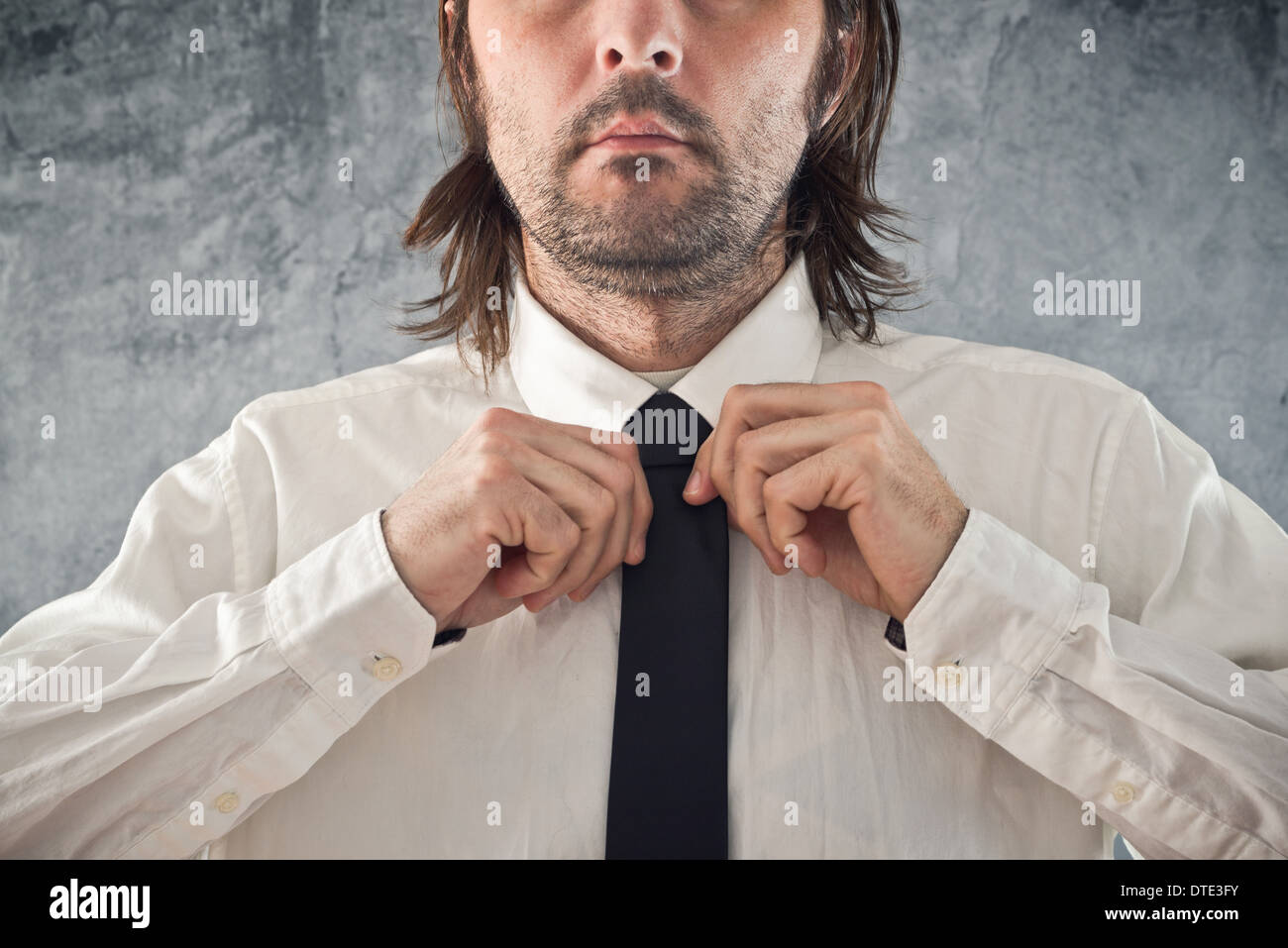 Tying tie hi-res stock photography and images - Alamy