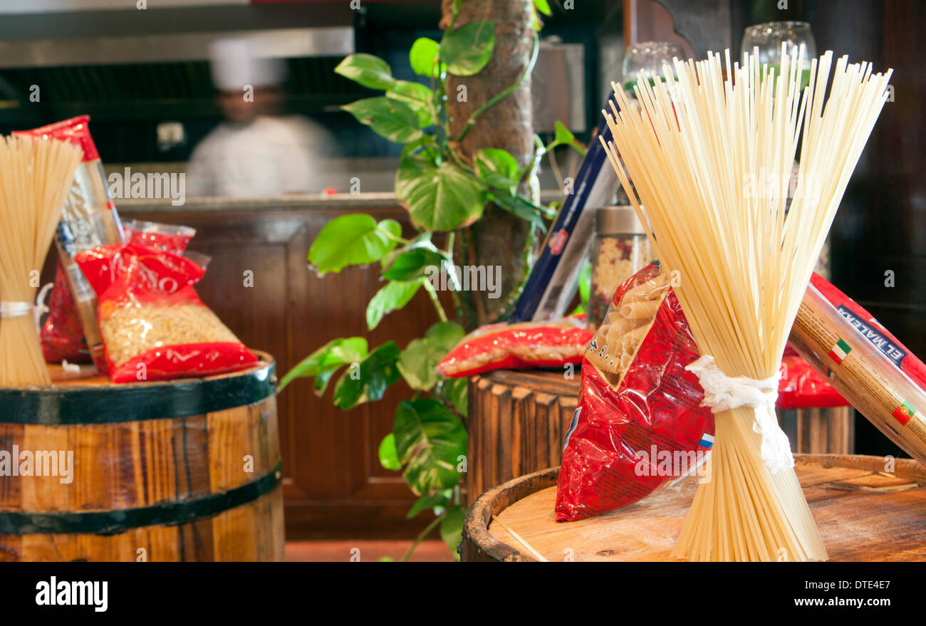 Very shallow focus image of pasta in an Italian restaurant/ with blurred chef Stock Photo