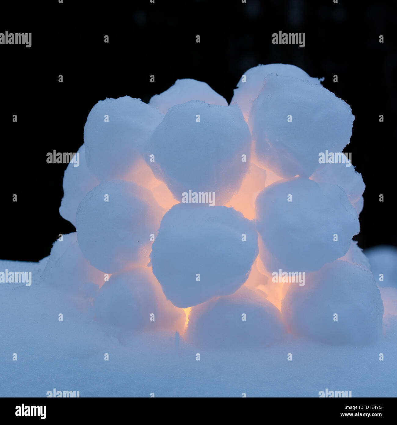 snowball lantern - small dome made of snowballs, lit candle inside Stock  Photo - Alamy