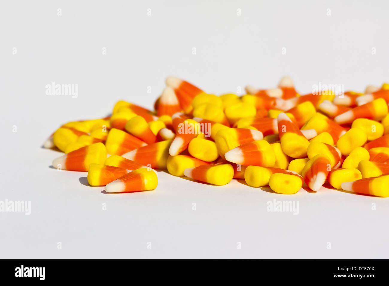Halloween candy corn sweets colorful trick or treat nobody from above overhead horizontal close up on white backgroud table in USA US  hi-res Stock Photo