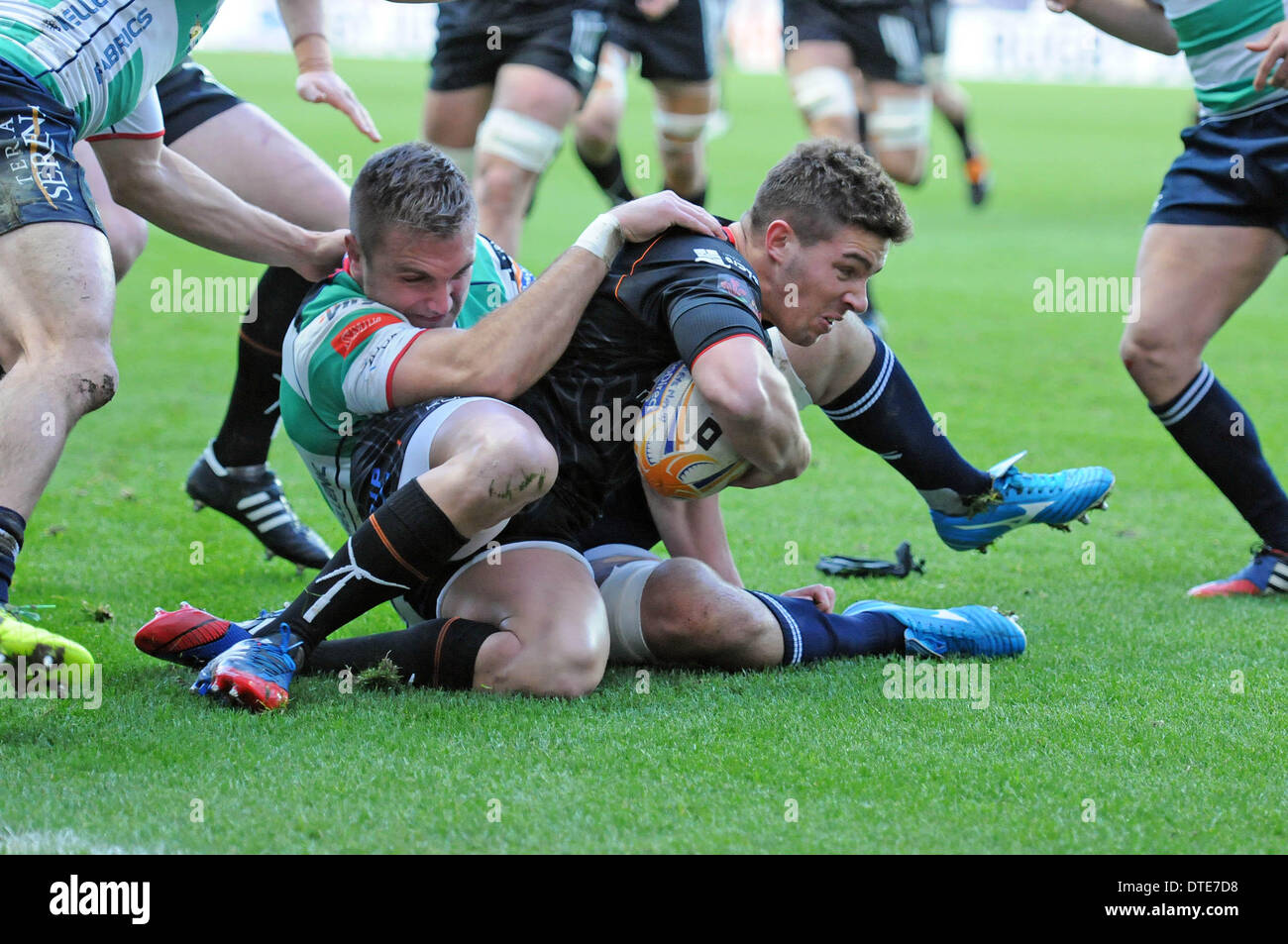 RaboDirect Pro 12 - Ospreys v Benetton Treviso - Swansea - 16th February  2014 : Ospreys Rhys Webb is brought down by Meyer Swanepoel of Treviso.  Credit: Phil Rees/Alamy Live News Stock Photo - Alamy