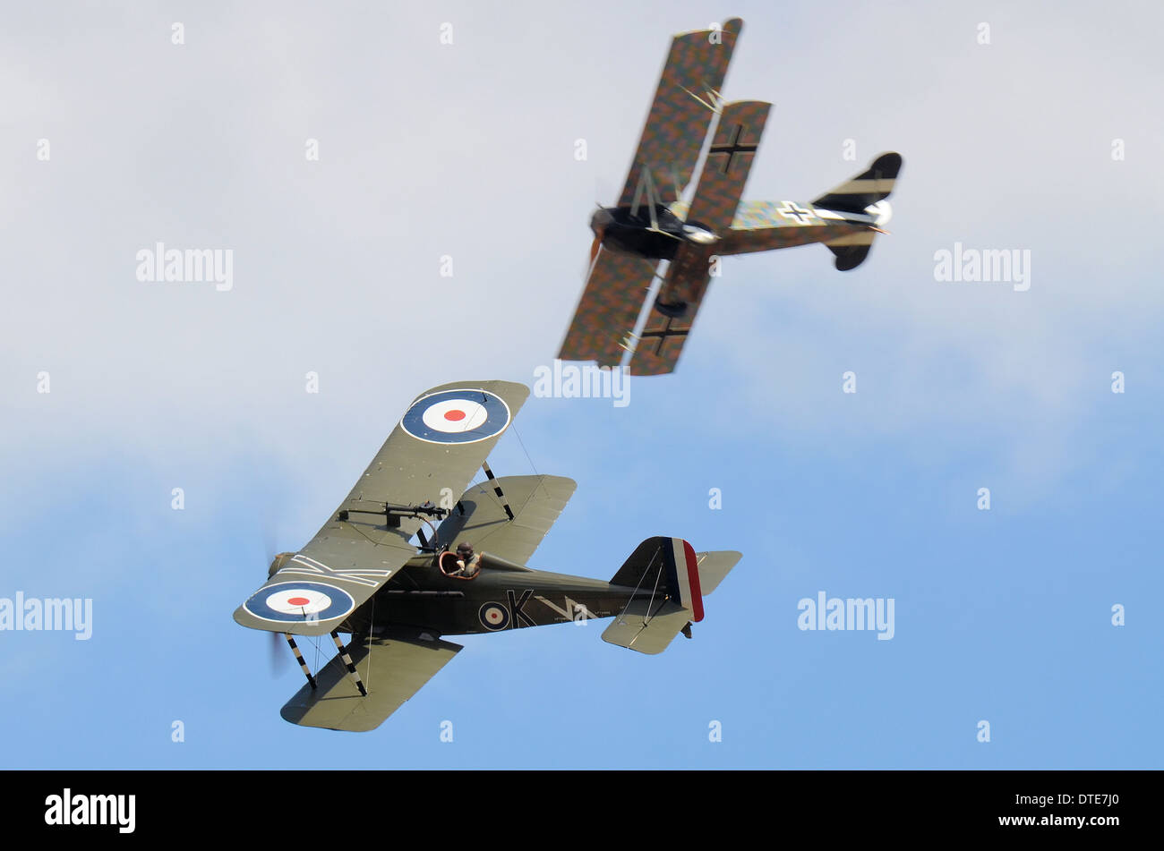 Two replica aircraft dogfight as if over the trenches of World War I - the Great War. One German, one British Royal Flying Corps Stock Photo