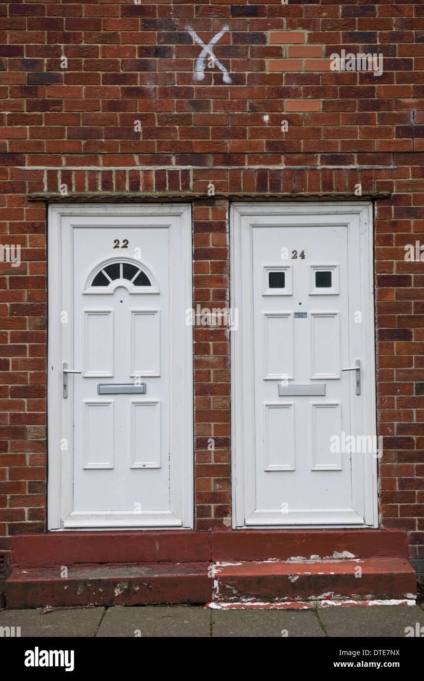 White number 22 & 24 plastic front doors of houses in Scarborough North  Yorkshire England UK Stock Photo - Alamy