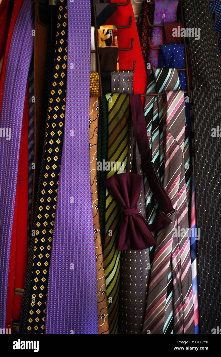 Ties hanging on tie hanger giving vertical colour stripes Stock Photo