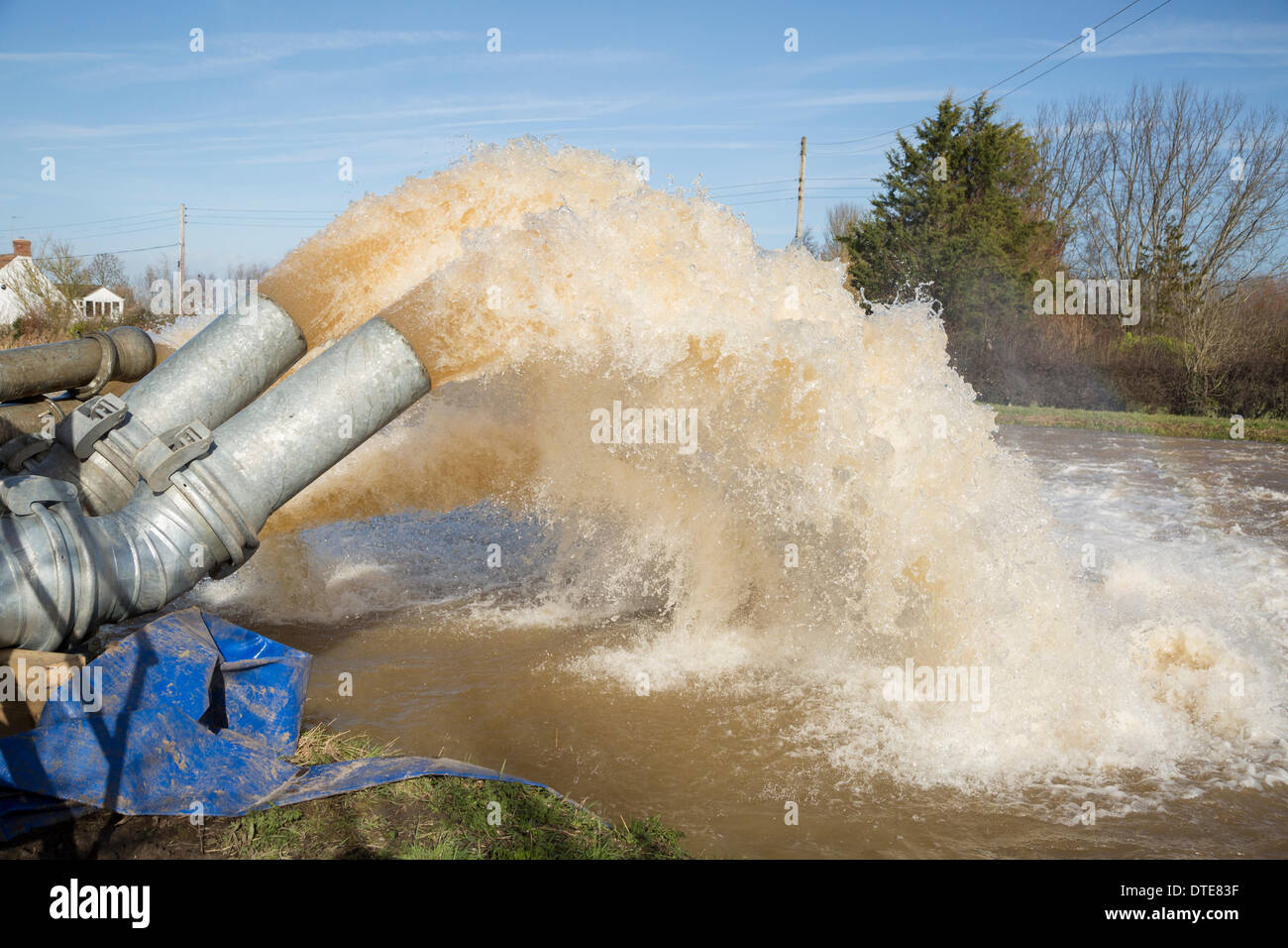 Burrowbridge, UK. 16th Feb, 2014. Additional diesel pumps aid the Saltmoor Pumping Station at Burrowbridge on February 16, 2014. The Environment Agency have drafted in additional capacity to help get rid of the huge volume of water from Northmoor into the River Parrett. Huge flooding has caused many residents in the villages of Burrowbridge and nearby Moorland to evacuate their homes. Credit:  Nick Cable/Alamy Live News Stock Photo