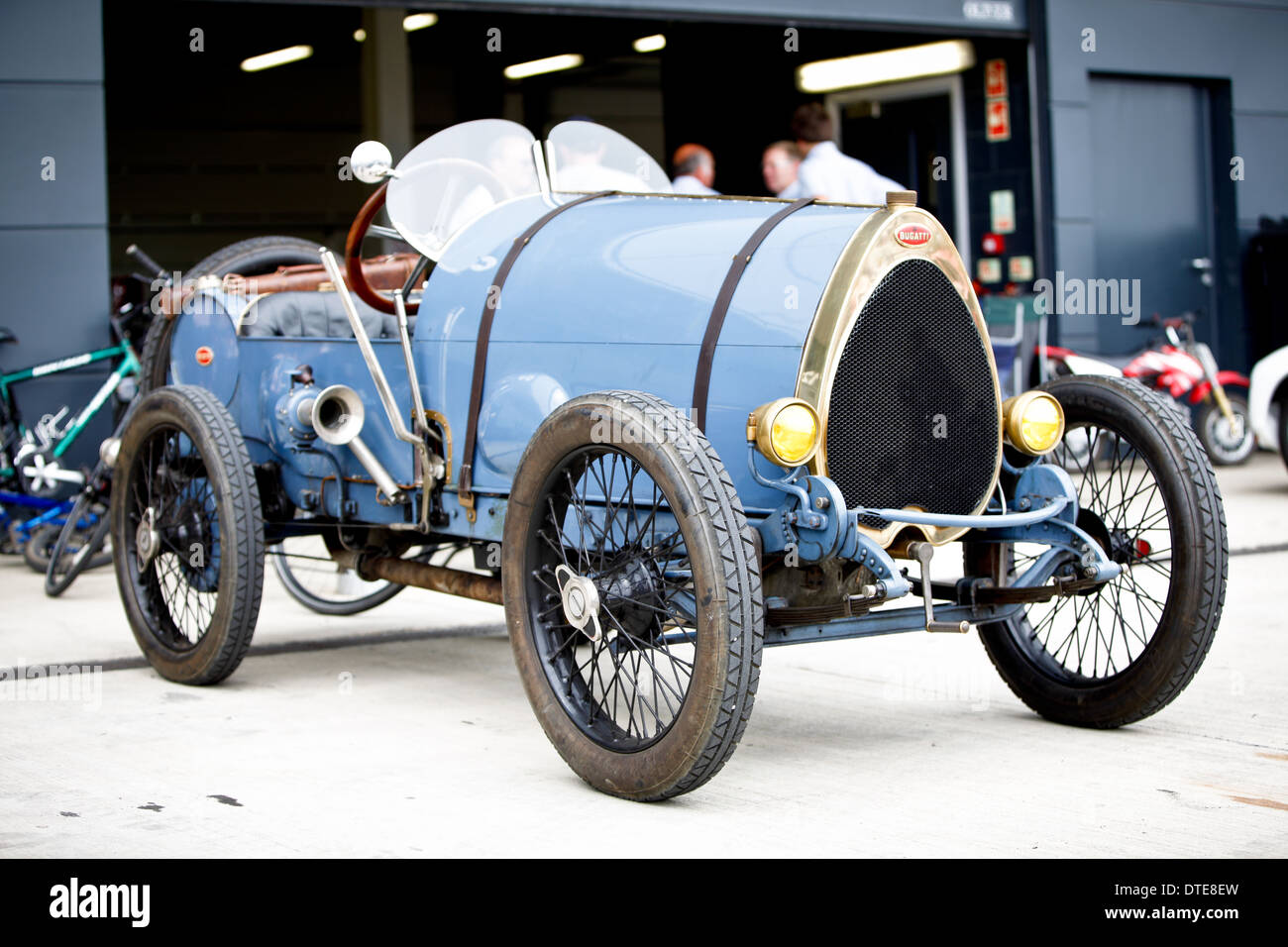 A vintage blue Bugatti car outside the pits at a classic car event in the UK Stock Photo