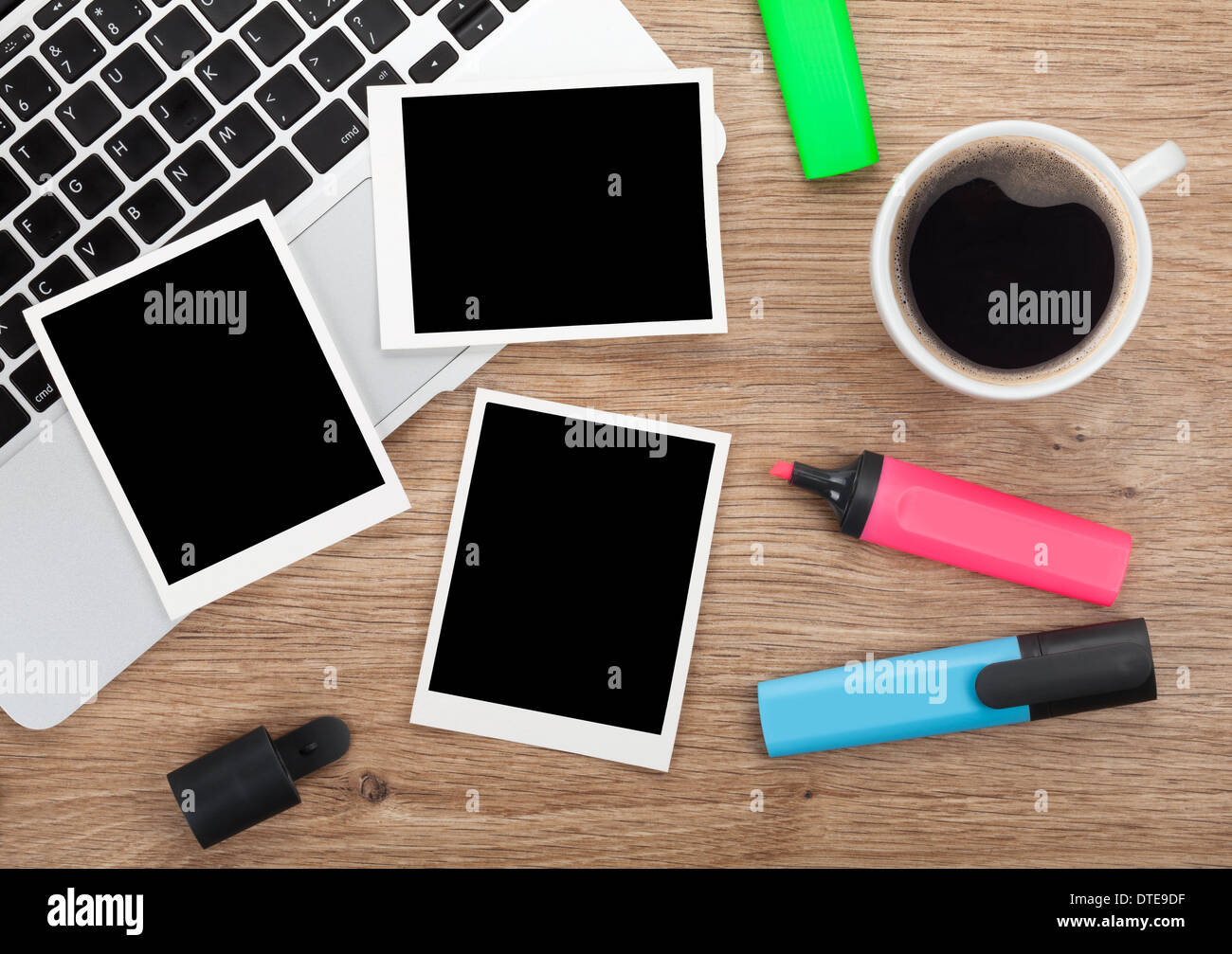 Blank instant photo frames over office table. View from above Stock Photo
