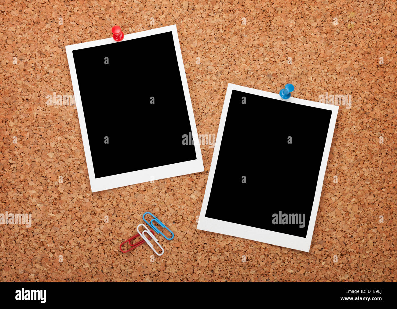 Blank instant photo frames on cork wooden background Stock Photo
