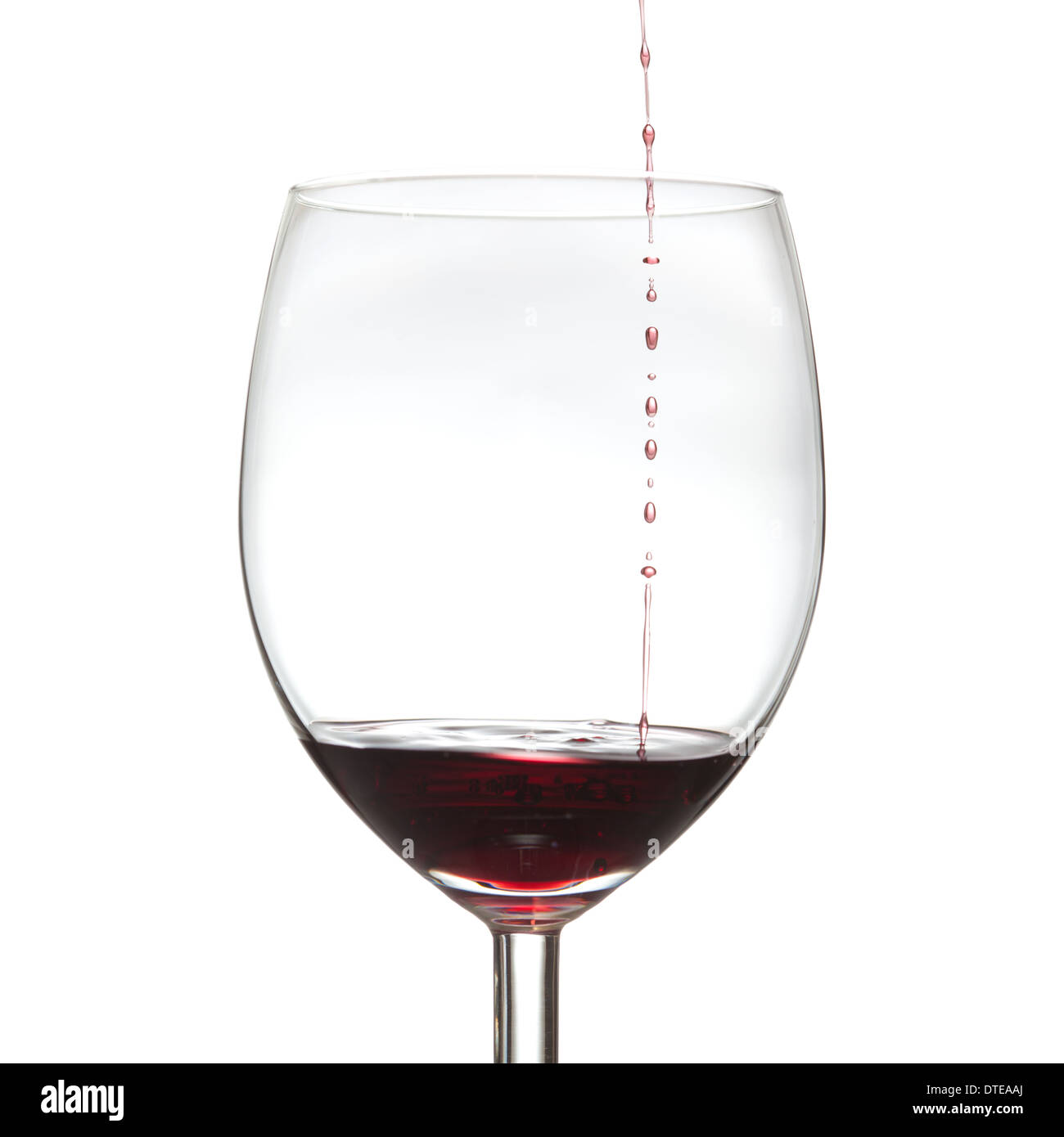 just a little drop red wine drops falling into a glass Stock Photo