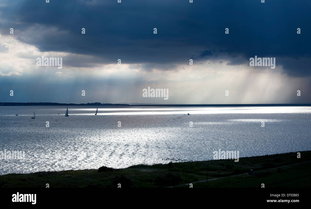 sailboats under dark sky in Fehmarn Germany Stock Photo