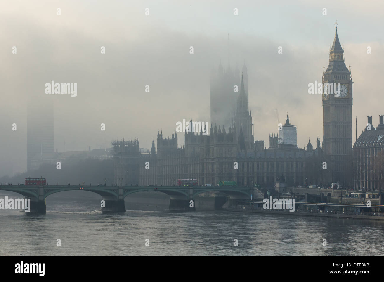 London fog, Big Ben and the Houses of Parliament on a foggy morning, London England United Kingdom UK Stock Photo