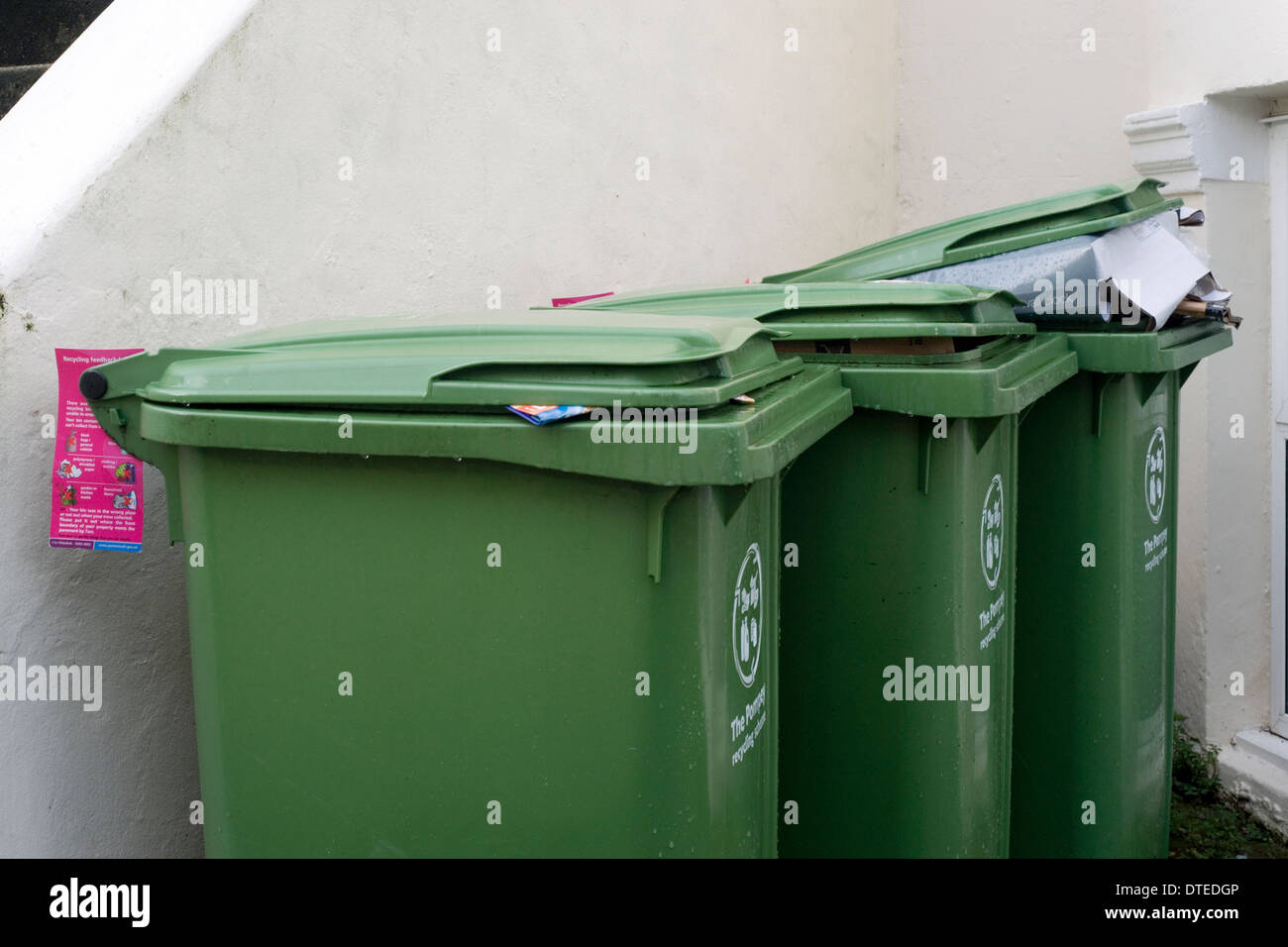 recycling bins left uncollected and ticketed due to a perceived violation of local council rules Stock Photo
