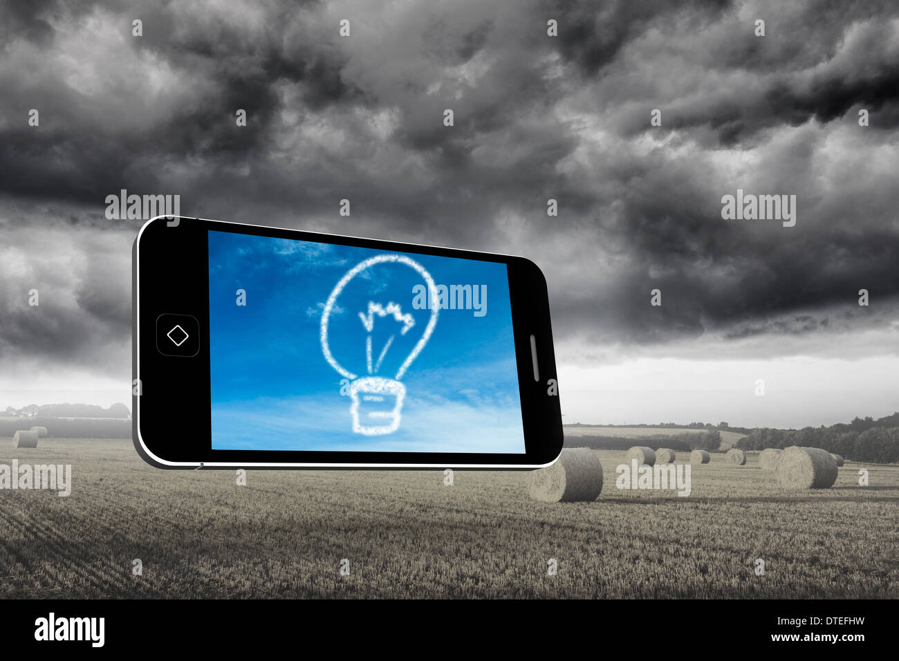 Composite image of cloud light bulb on smartphone screen Stock Photo
