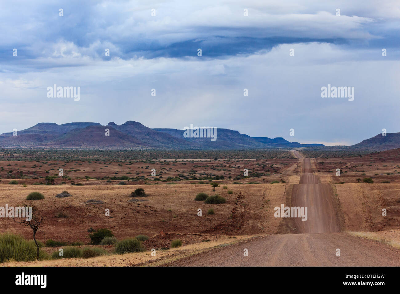 African road crosses ridges of small gently rolling hills in straight