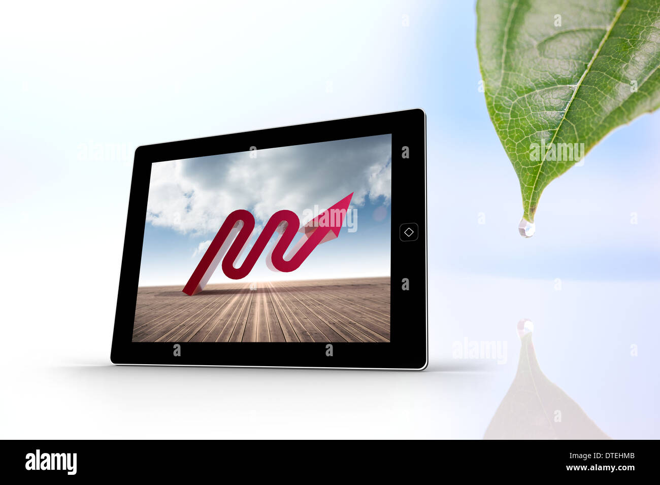 Composite image of red arrow on tablet screen Stock Photo