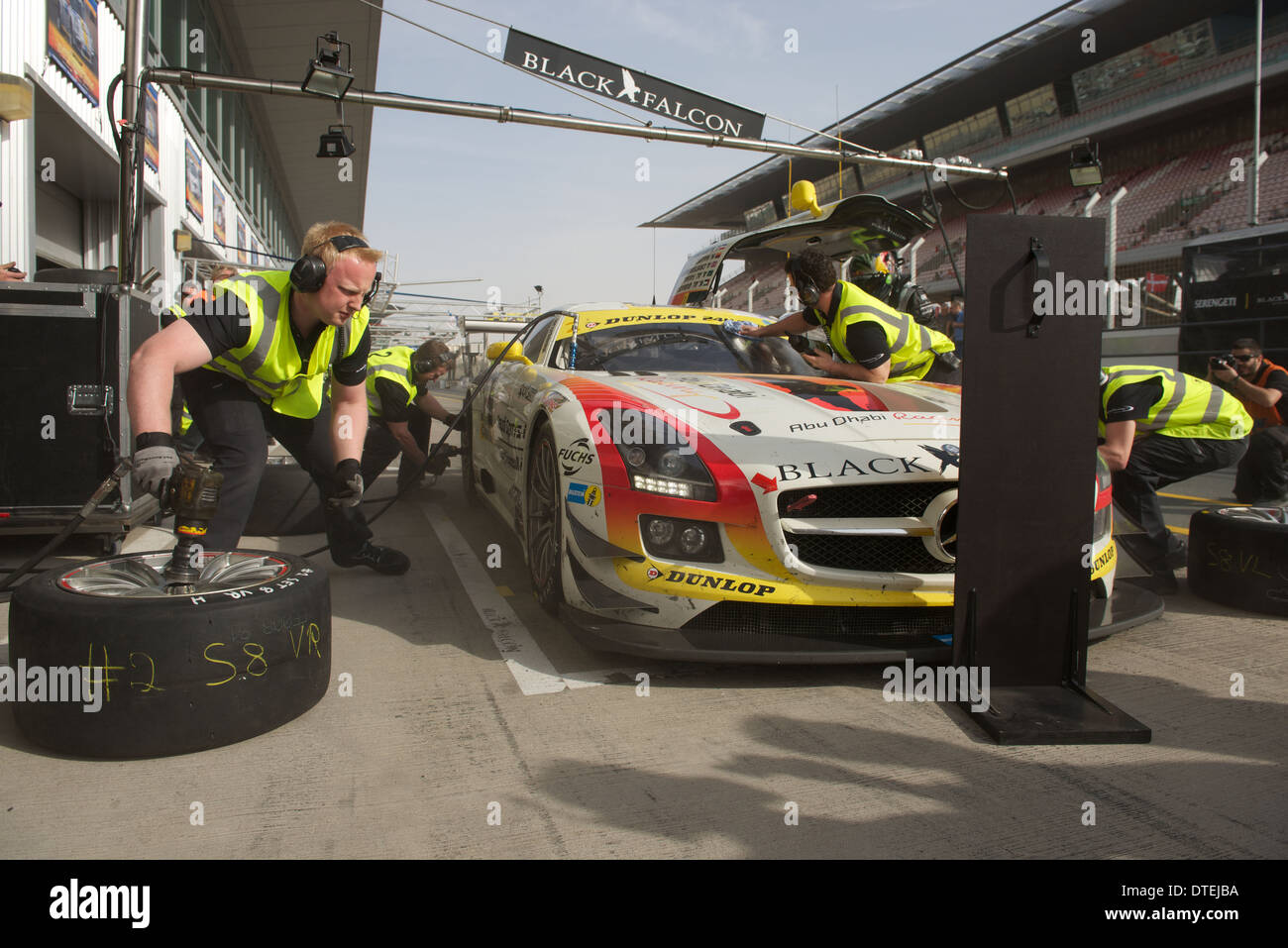 The Mercedes SLS AMG GT3 of the Black Falcon 2 team during a pit stop for new tyres in the Dunlop 24h Dubai endurance ca race Stock Photo