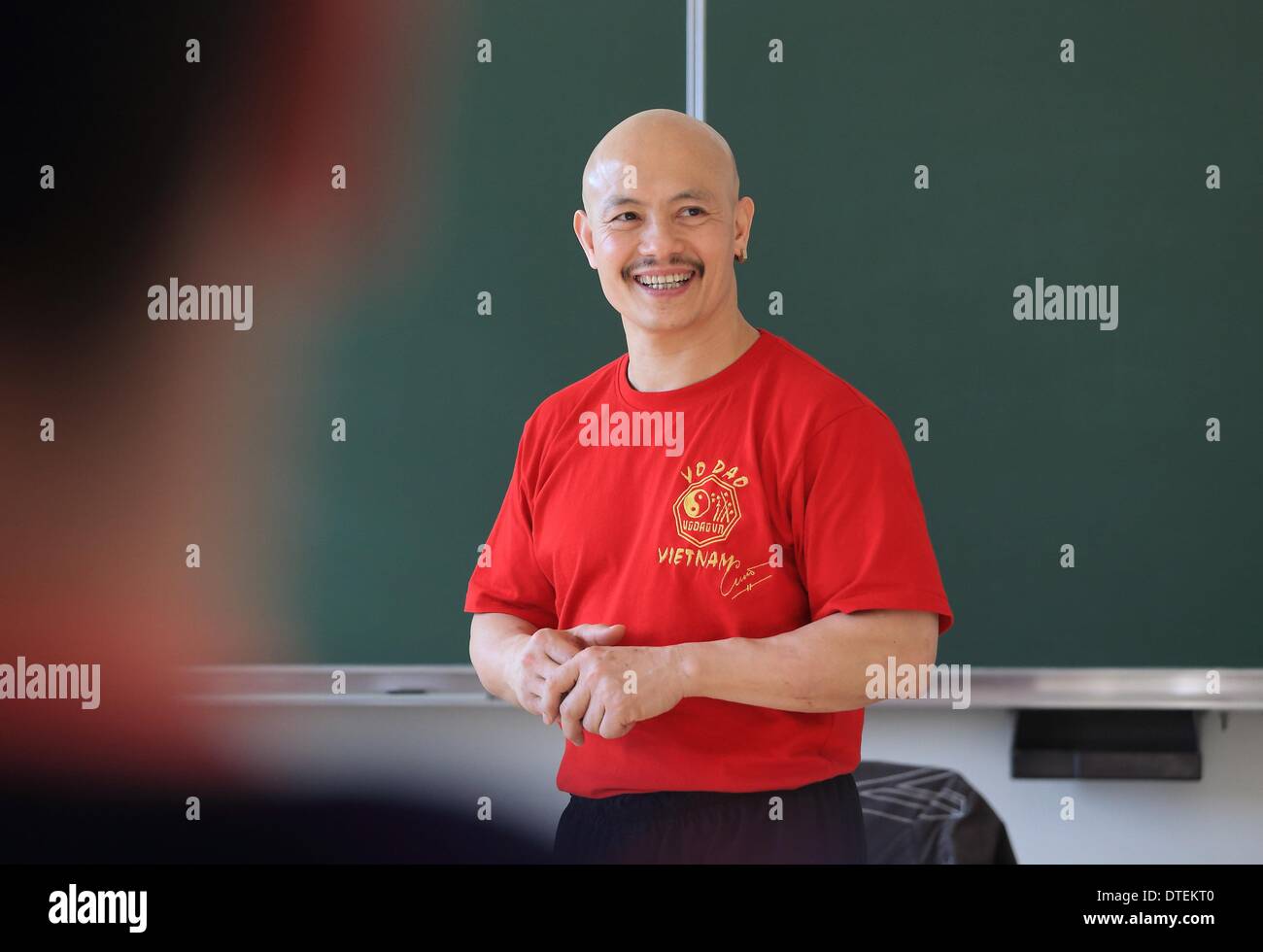 Aschersleben, Germany. 12th Feb, 2014. Kung Fu Grandmaster Chu Tan Cuong teaches policemen at the police school in Aschersleben, Germany, 12 February 2014. Officials are educated in breathing techniques for stress and conflict management. Photo: Jens Wolf/dpa/Alamy Live News Stock Photo