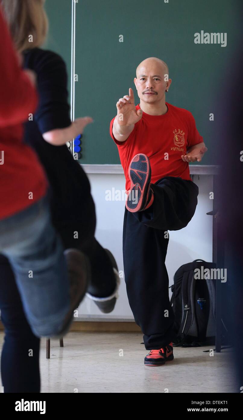 Aschersleben, Germany. 12th Feb, 2014. Kung Fu Grandmaster Chu Tan Cuong teaches policemen at the police school in Aschersleben, Germany, 12 February 2014. Officials are educated in breathing techniques for stress and conflict management. Photo: Jens Wolf/dpa/Alamy Live News Stock Photo