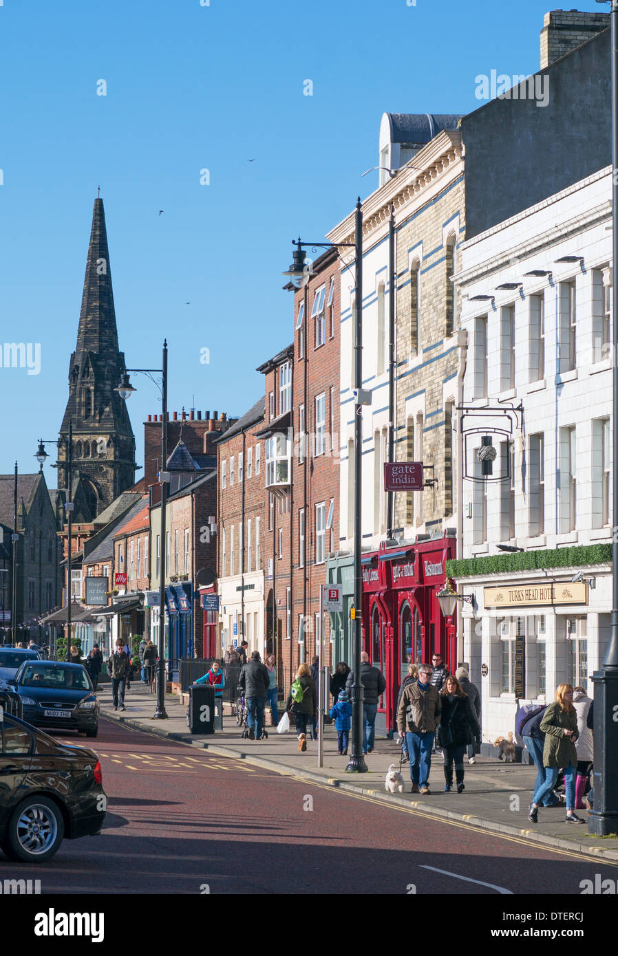 People walking along Tynemouth Front Street north east England UK Stock Photo