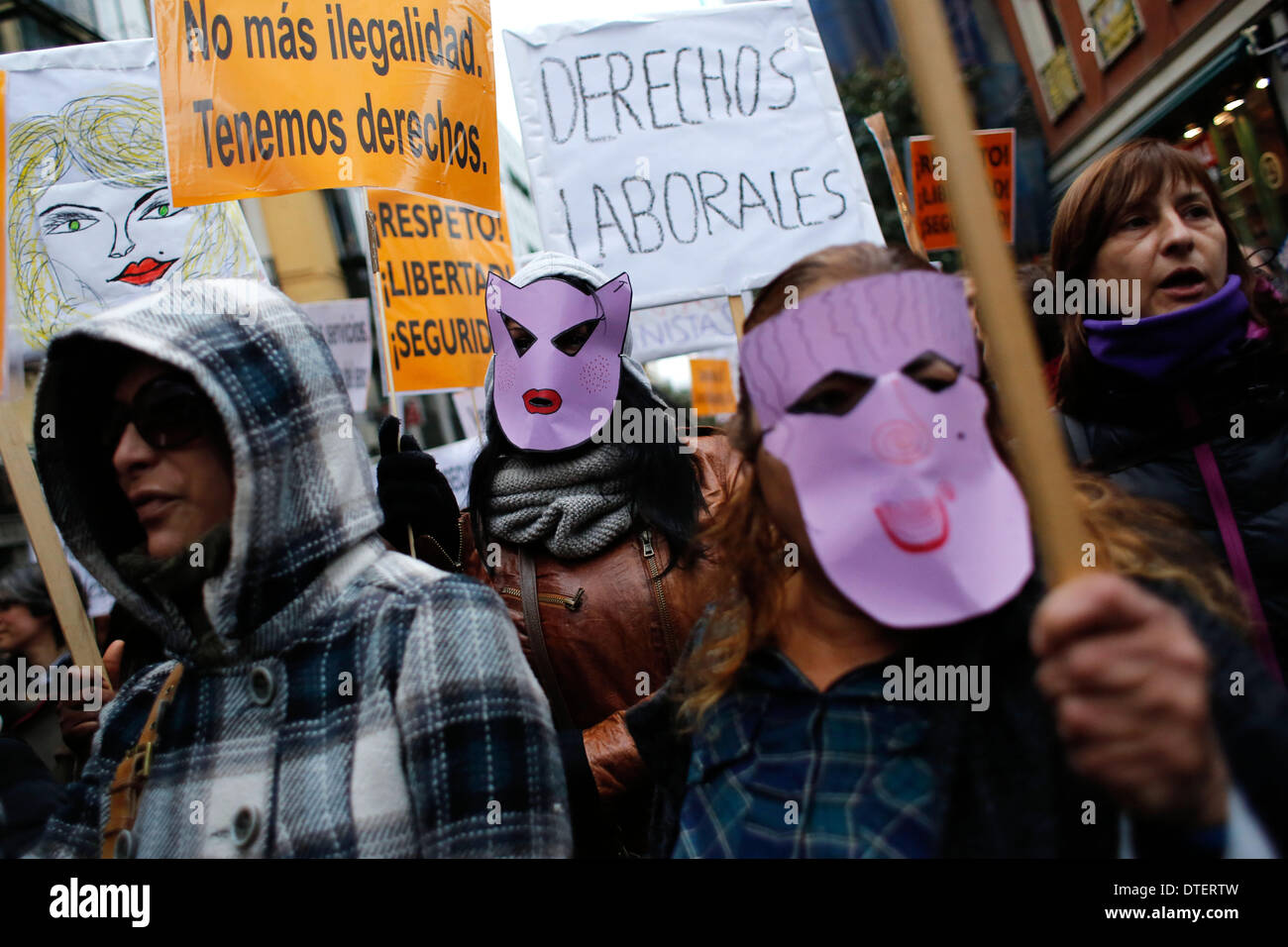 Madrid, Spain. 15th Feb, 2014. Prostitutes wear masks and carry 